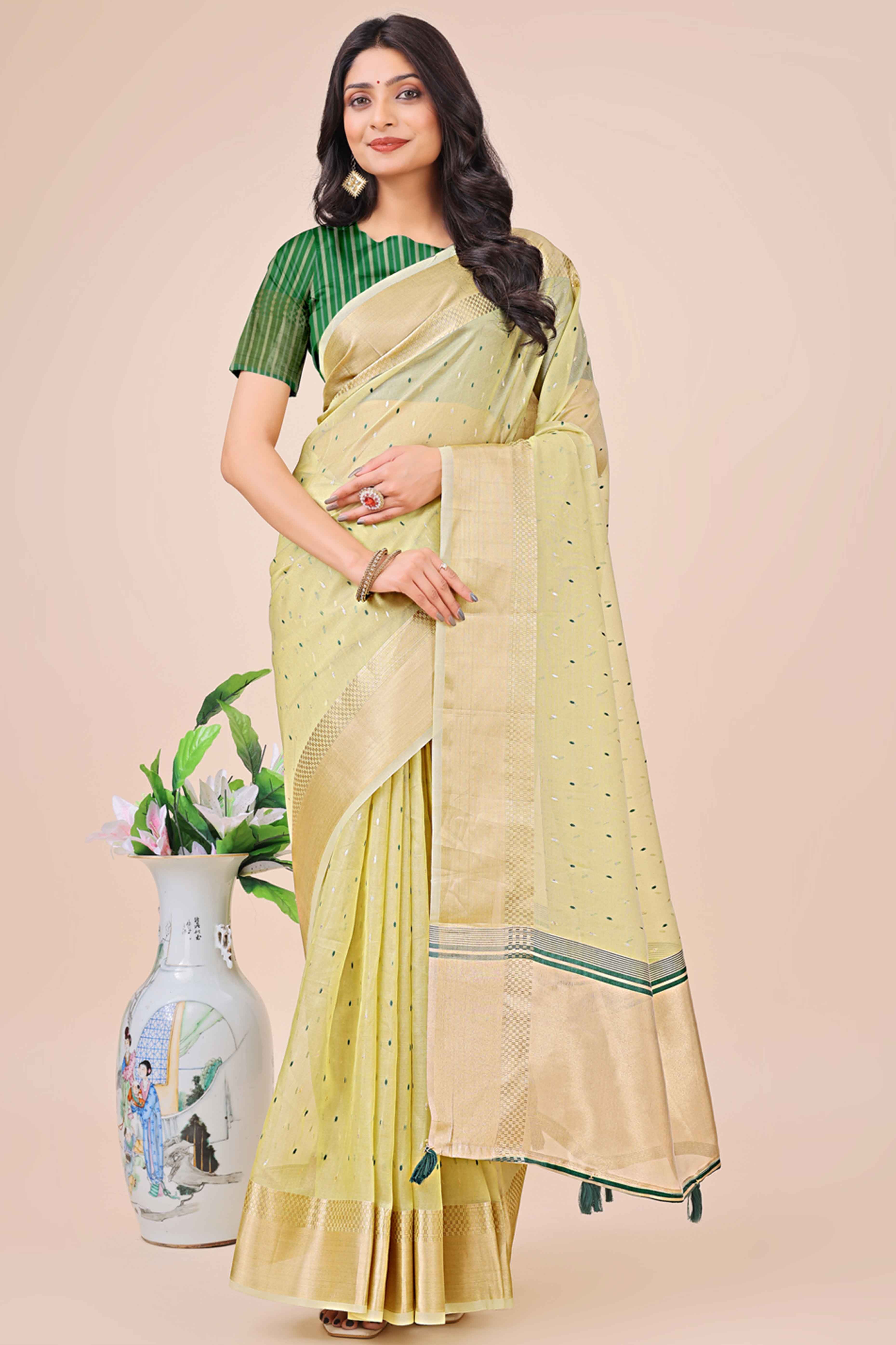 Light Green Organza Saree Adorned With Fine Zari Weaving & Stylish Tassel Edging