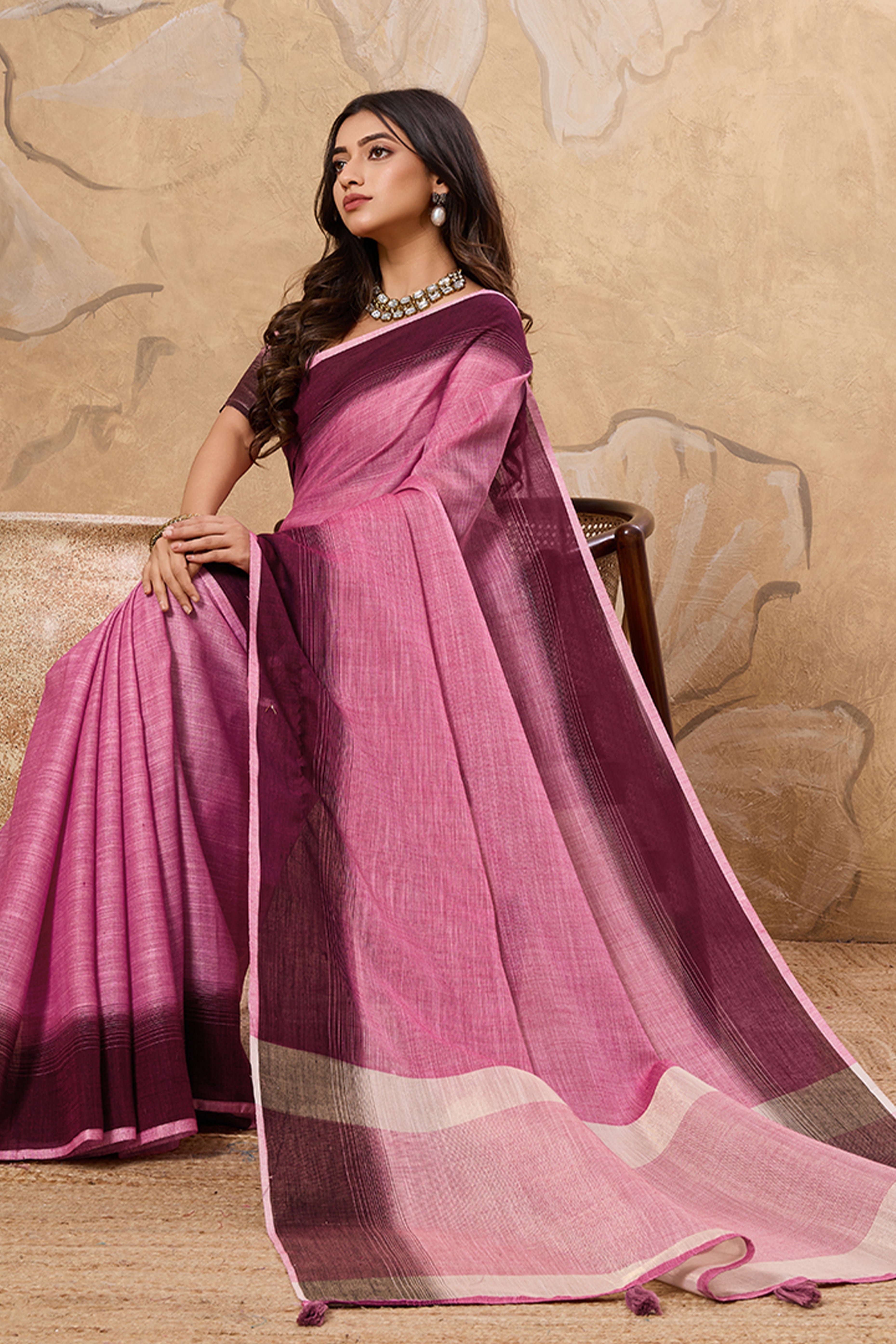Stylish Pink Linen Saree With Zari Weaving Work & Tassel Pallu Charm