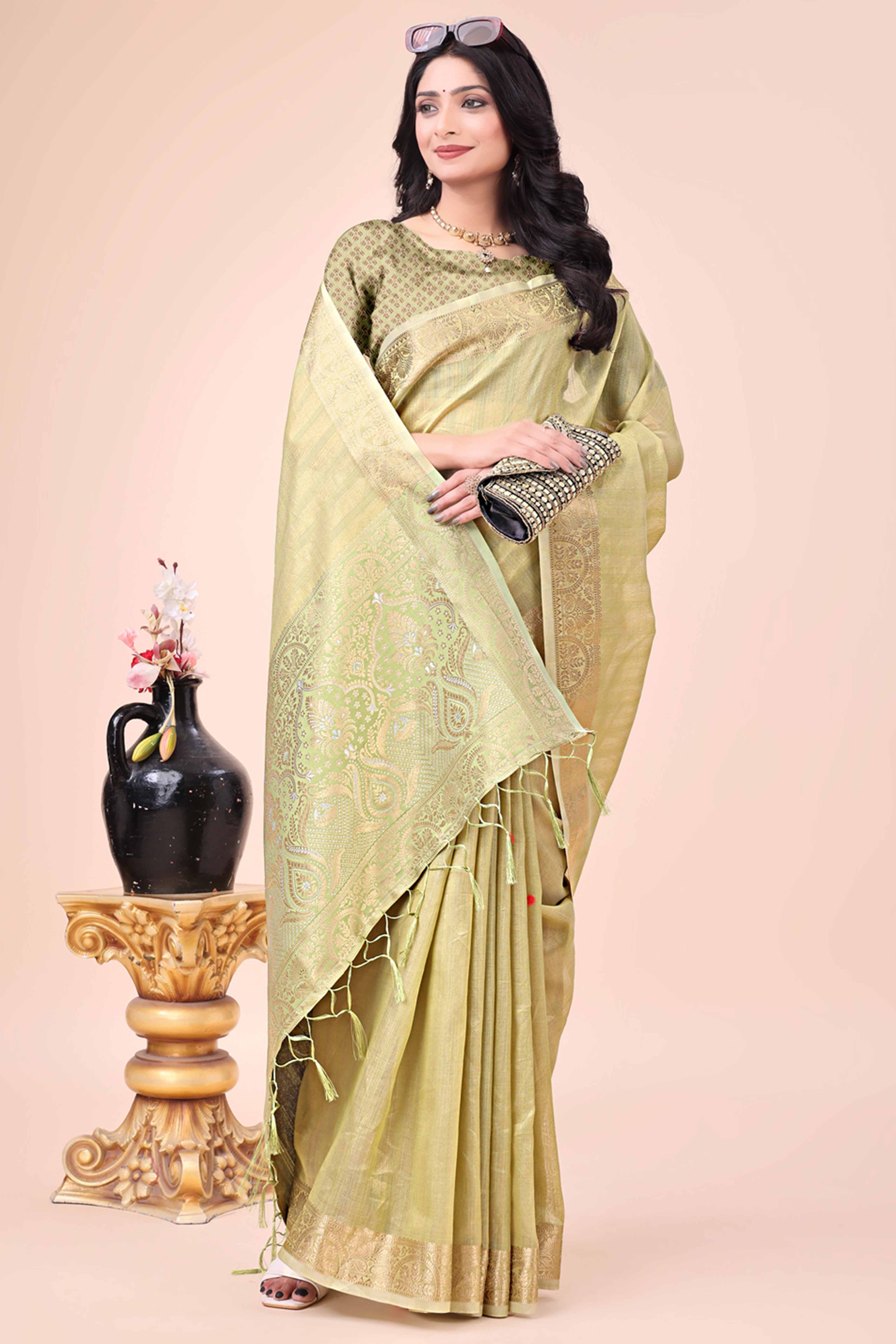 Green Organza Saree With Floral Zari Weave & Tassel Accents