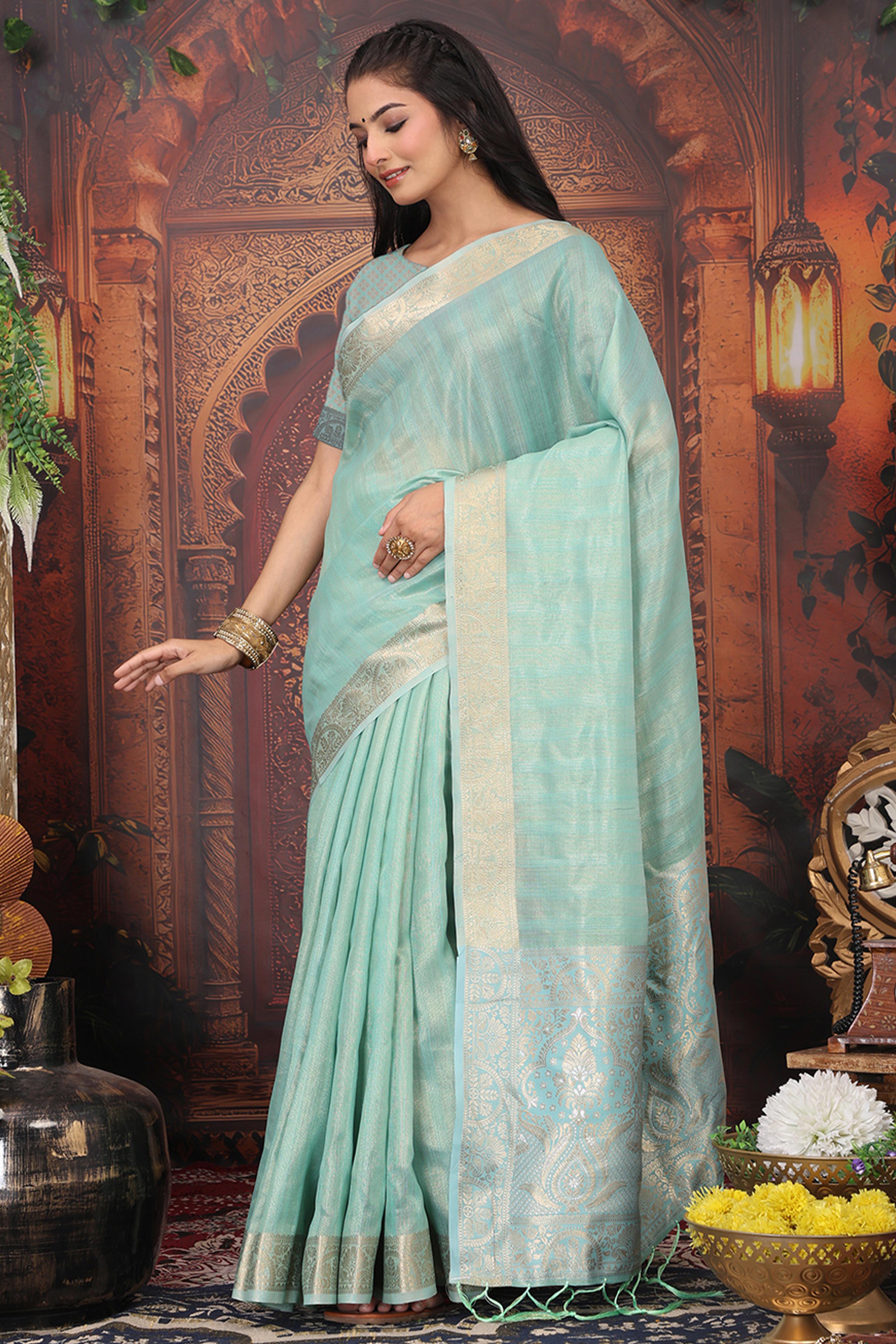 Turquoise Organza Saree Adorned With Floral Zari Weaving & Graceful Tassel Pallu