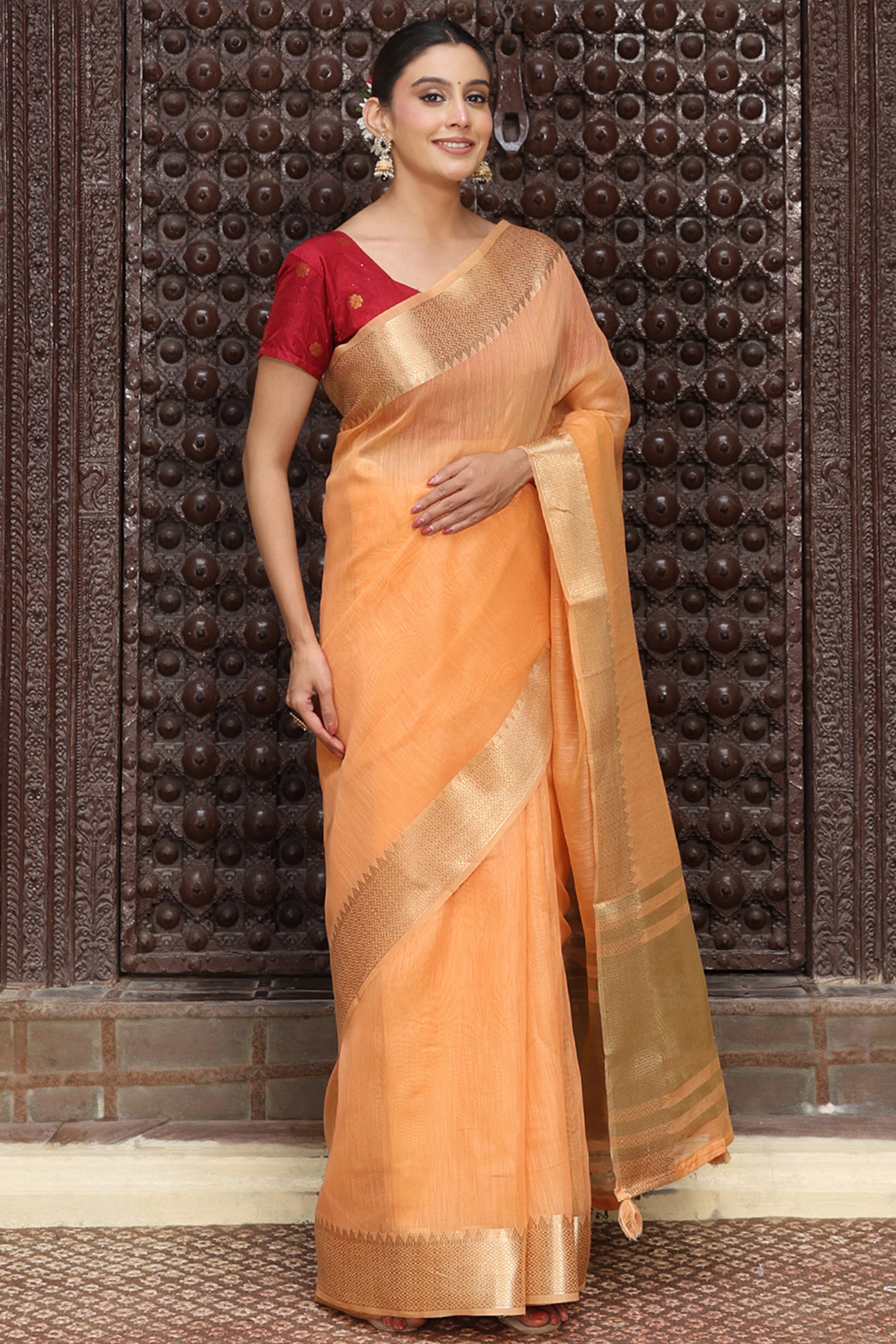 Trendy Orange Cotton Blend Saree Showcasing Elegant Zari Weaving & Tassel Border Pallu
