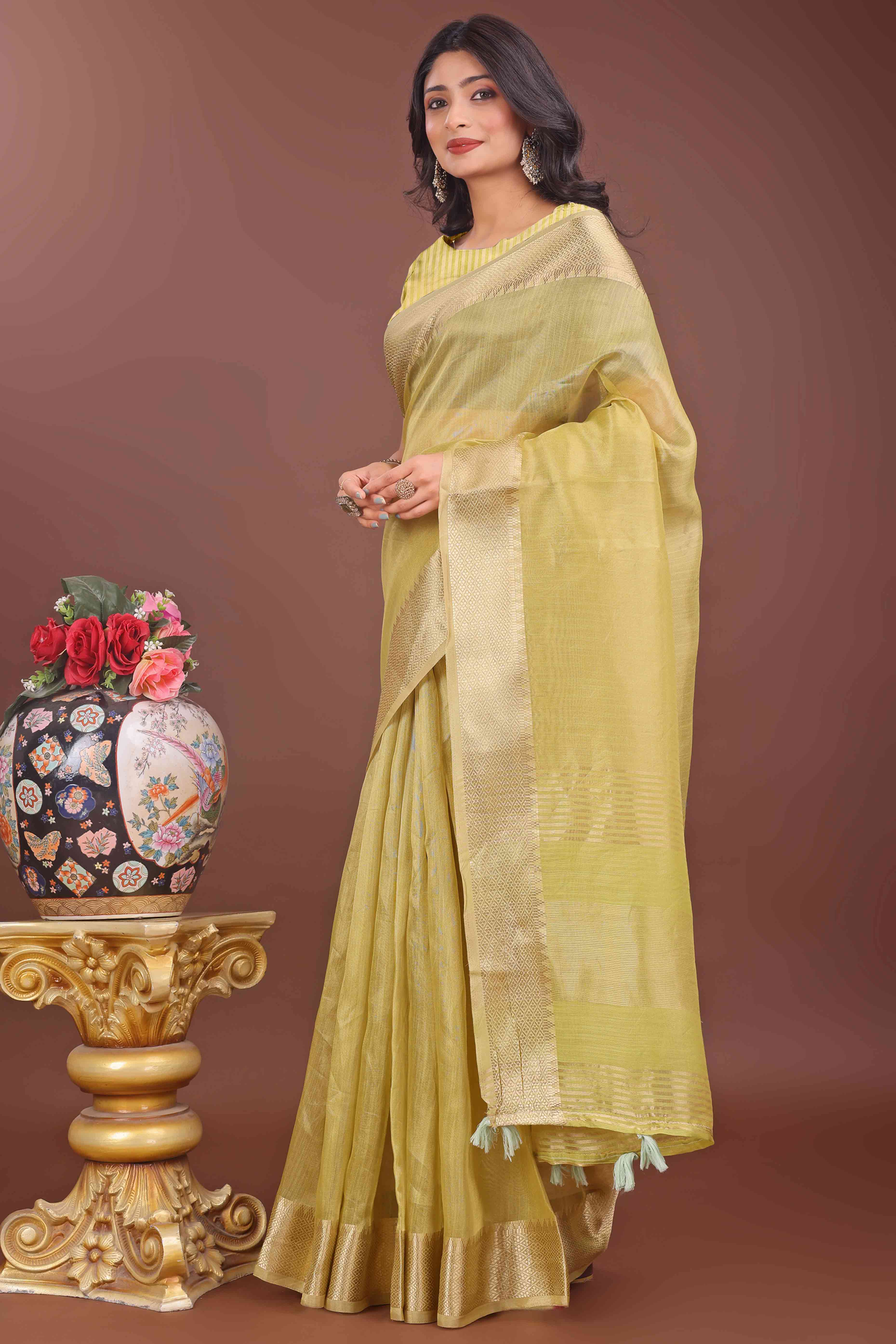 Green Solid With Zari Woven Organza Saree With Tassel Border