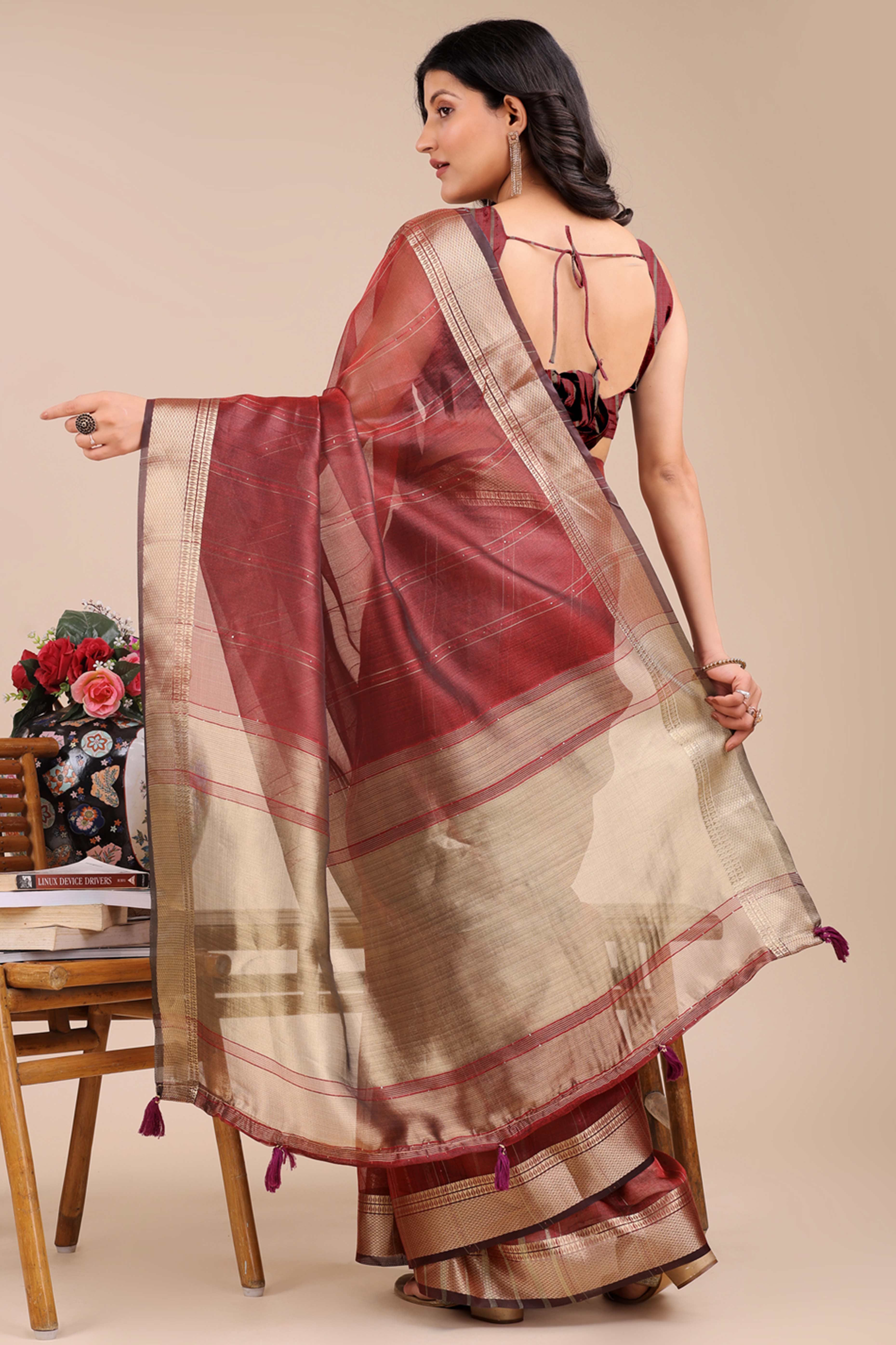 Maroon Hue Organza Saree with Shimmering Zari Border Weave