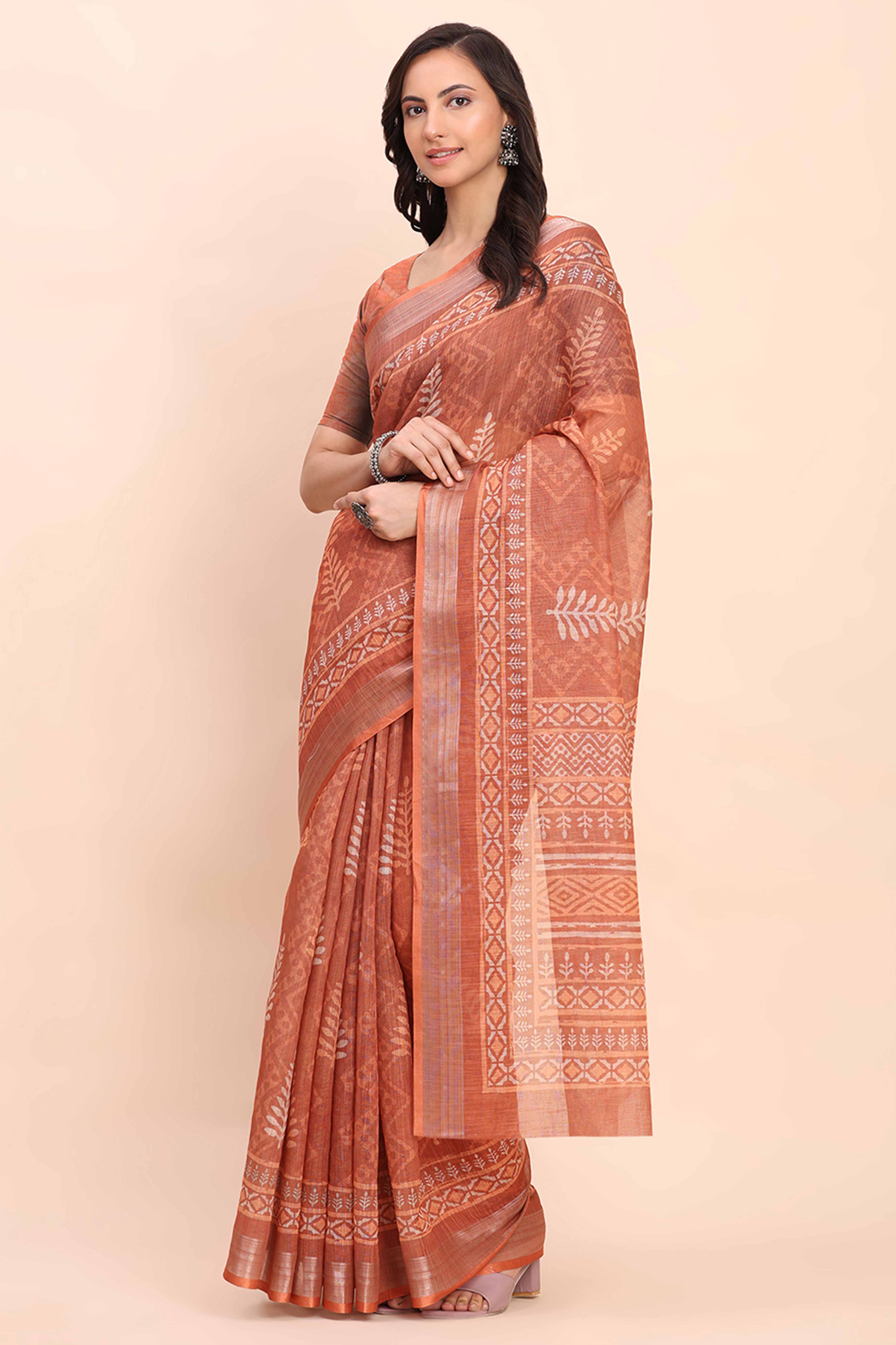 Rust Linen Saree with Intricate Silver Weaving