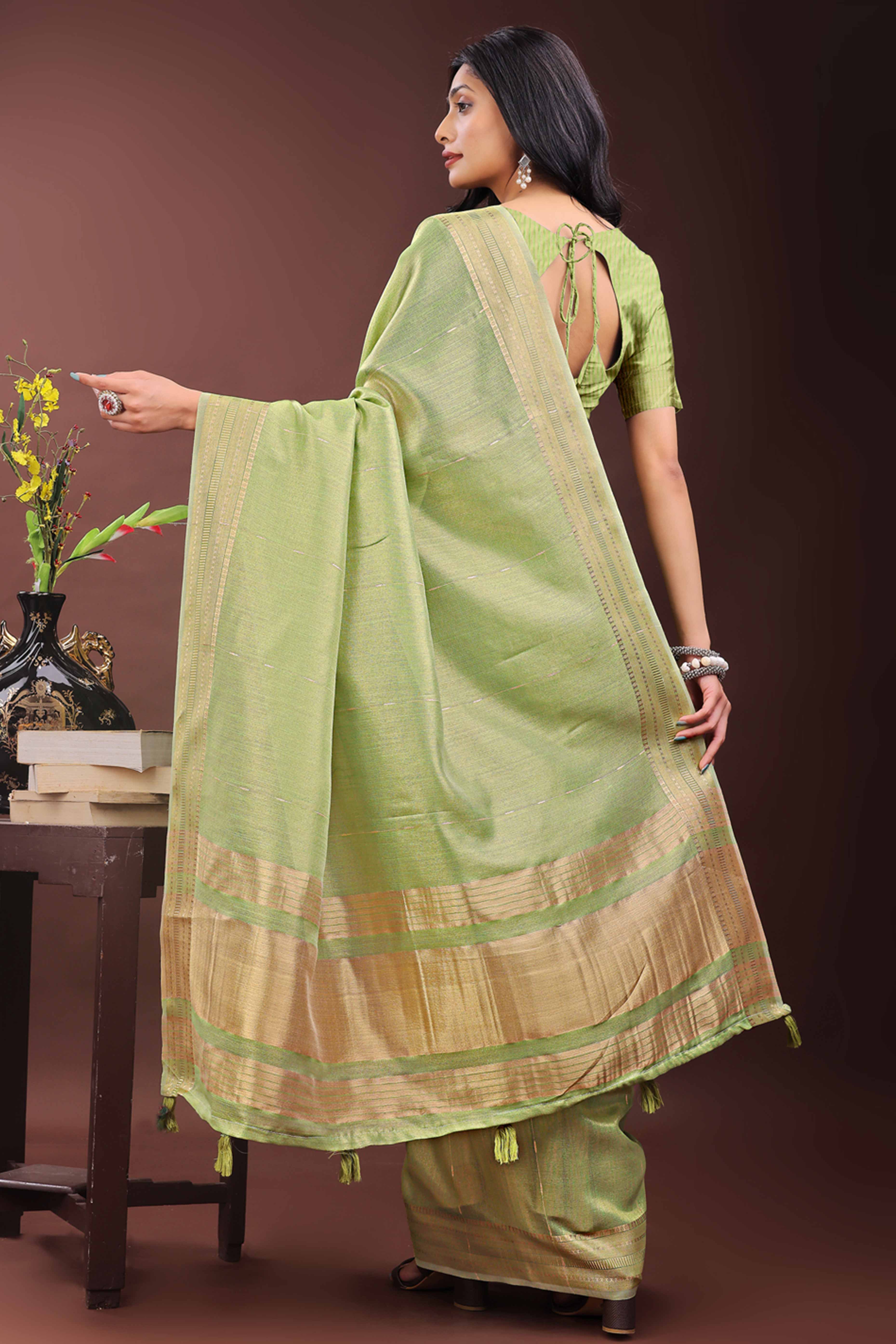 Green Organza Saree Adorned With Zari Weave & Tassel Edges