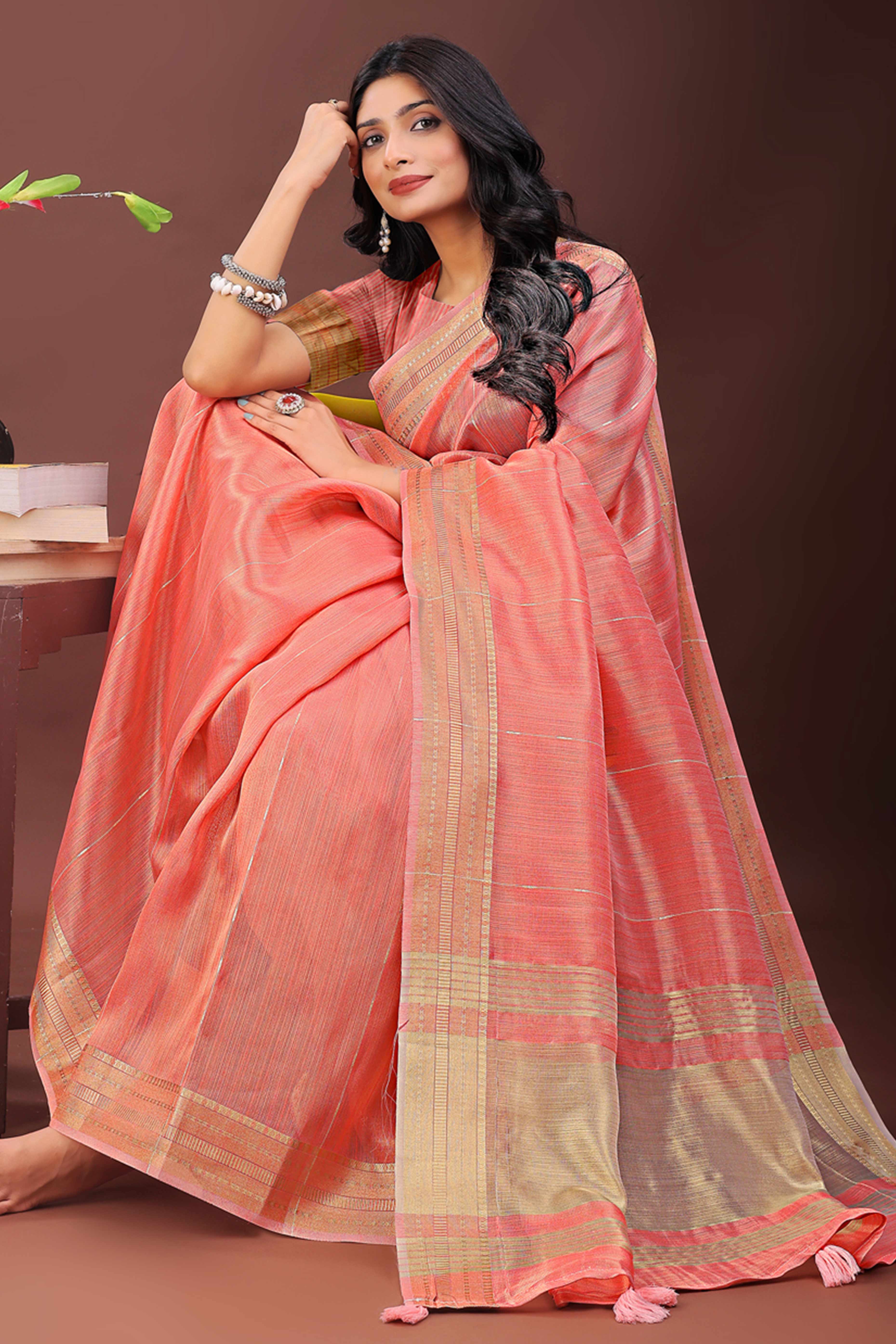 Coral Pink Organza Saree Adorned With Zari Weave & Tassel Edges