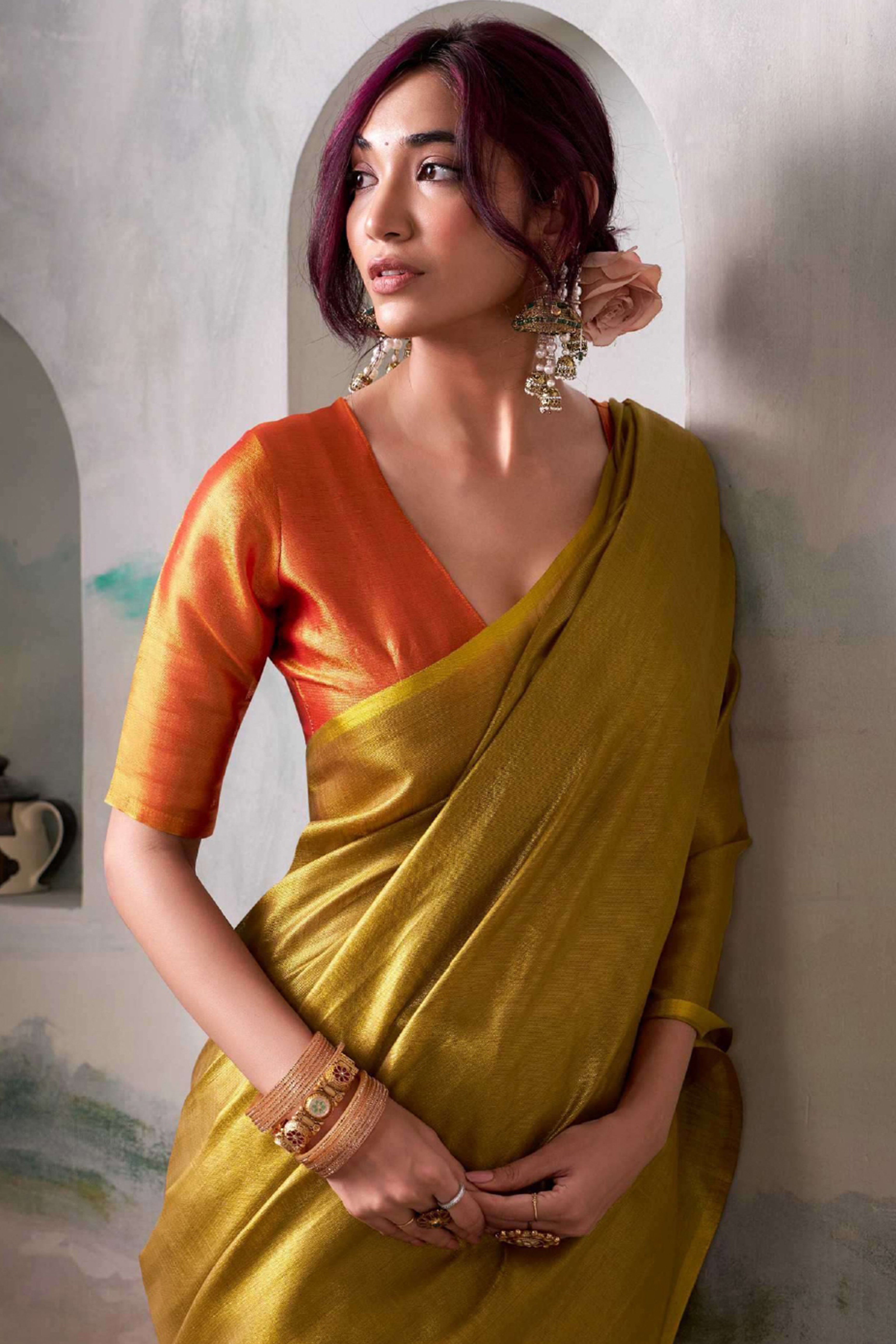 Graceful Dark Mustard Tissue Silk Blend Saree Adorned with Intricate Zari Weaving & Tassel Pallu