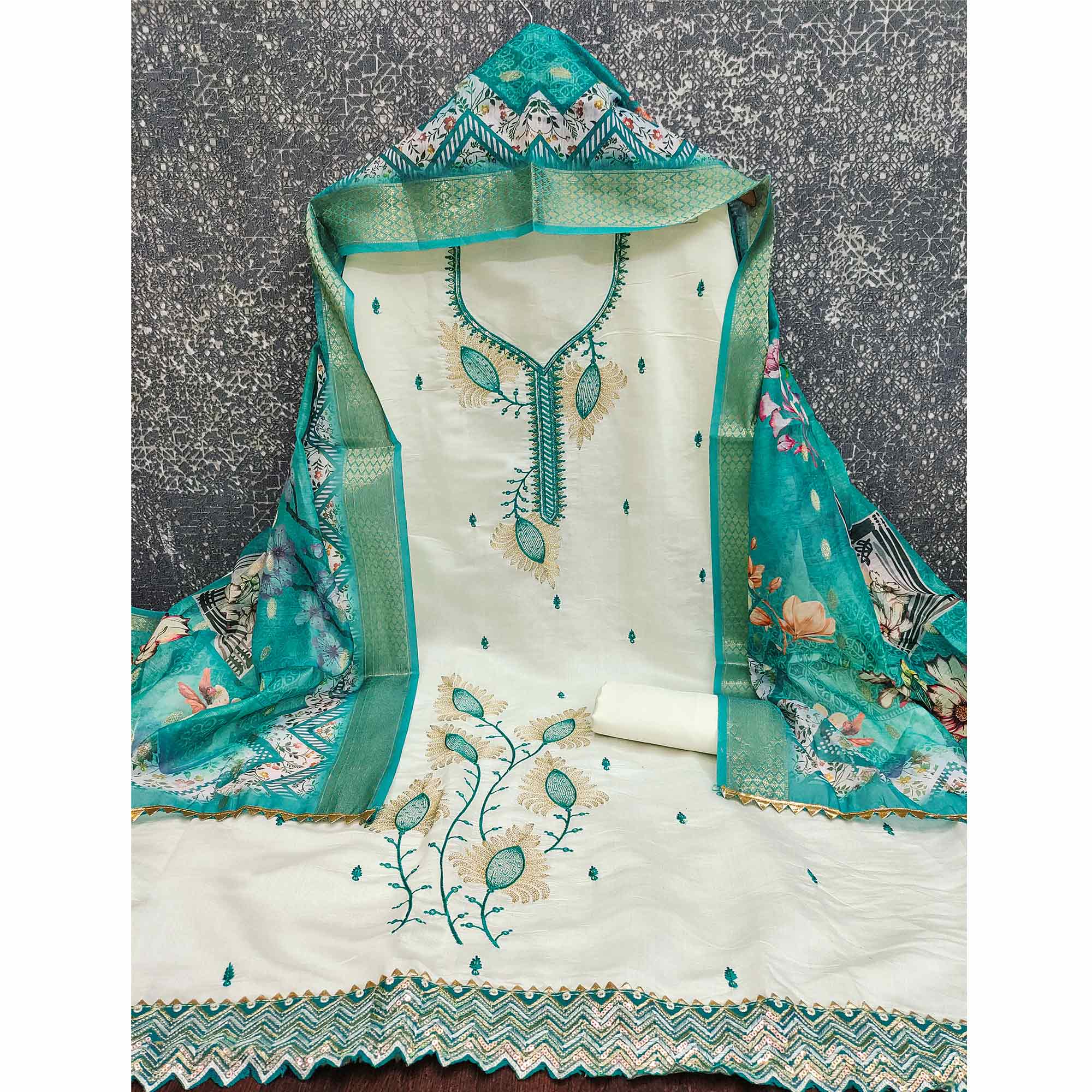 Elegant Cream & Turquoise Floral Embroidered Roman Cotton Silk Dress Material With Sequins Work