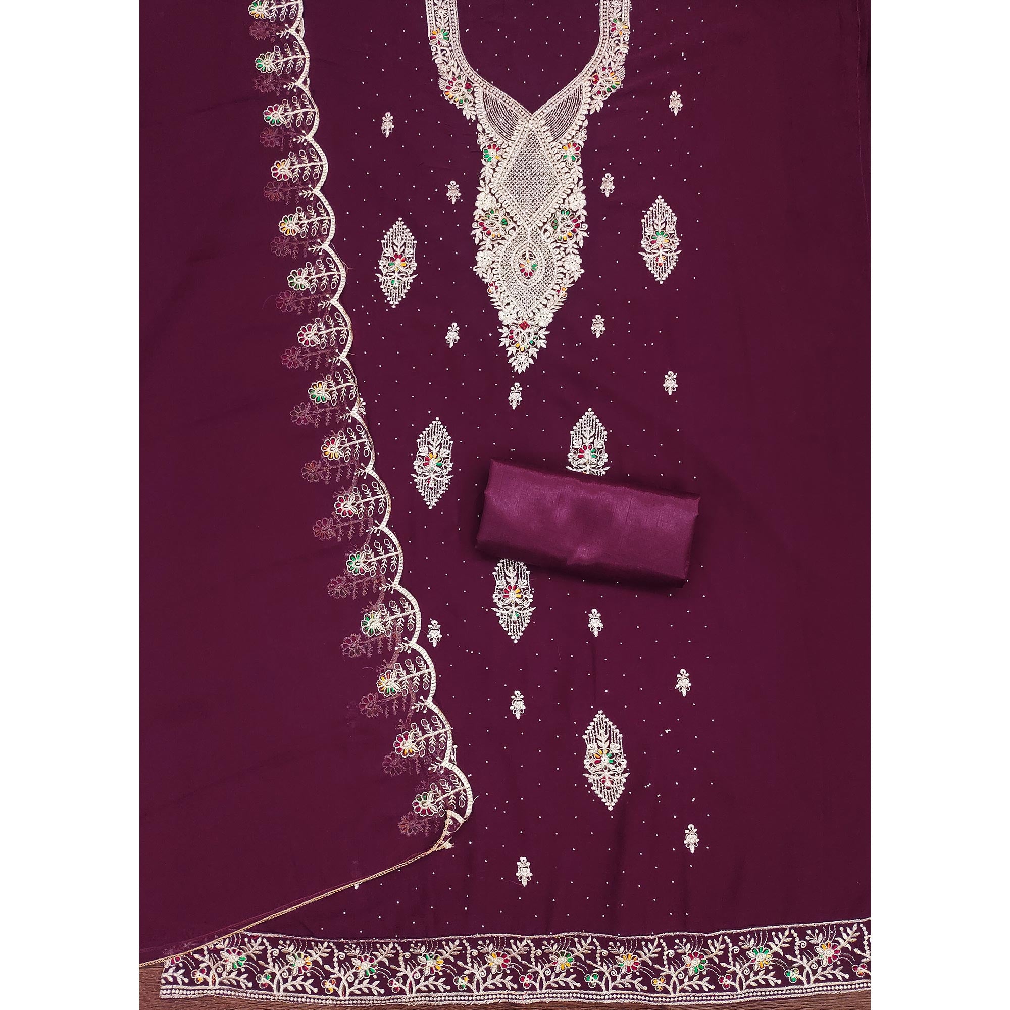 Wine Georgette Dress Material Adorned With Elegant Floral Embroidery & Shimmering Swarovski Work