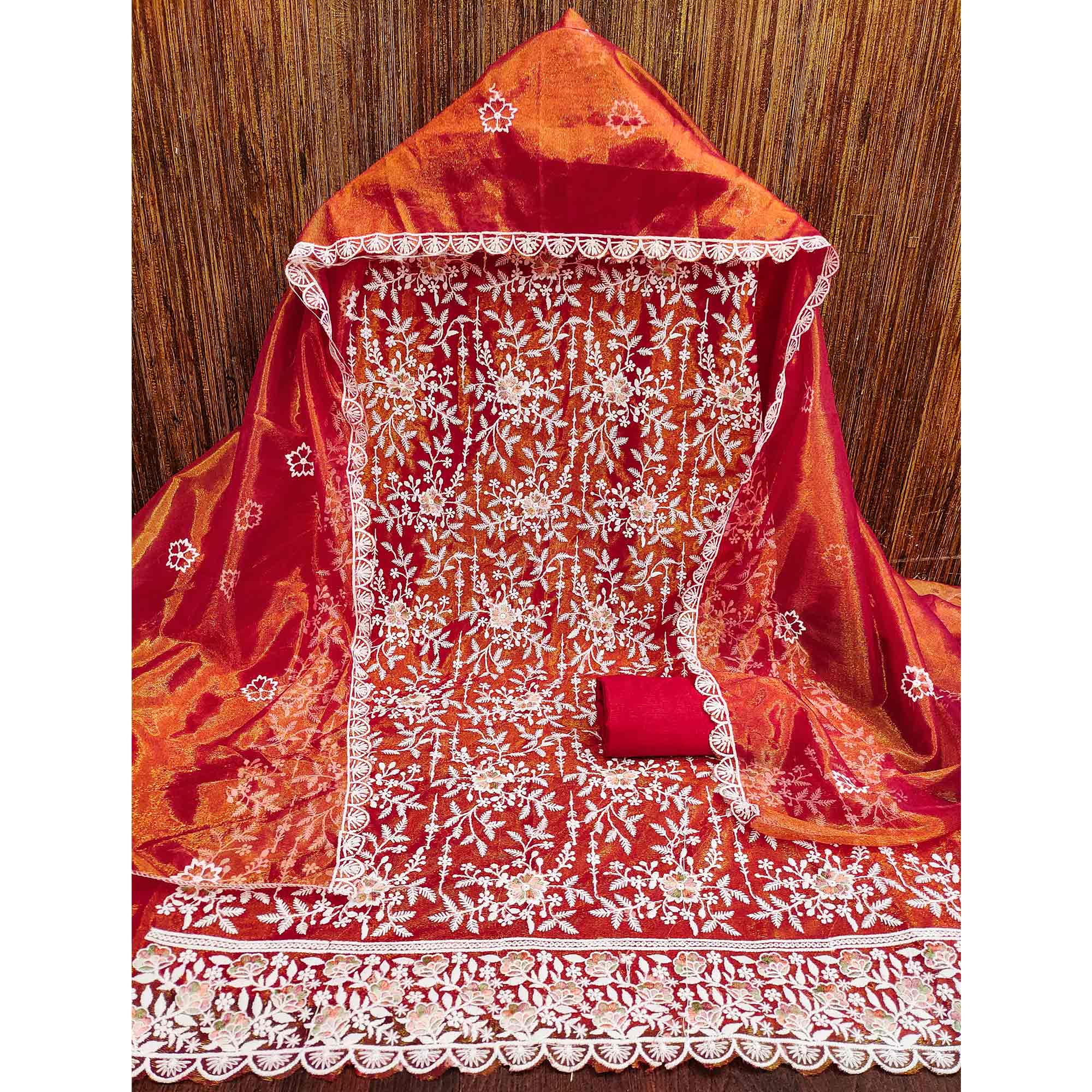 Stunning Rust Dress Material Adorned with Intricate Floral Embroidery