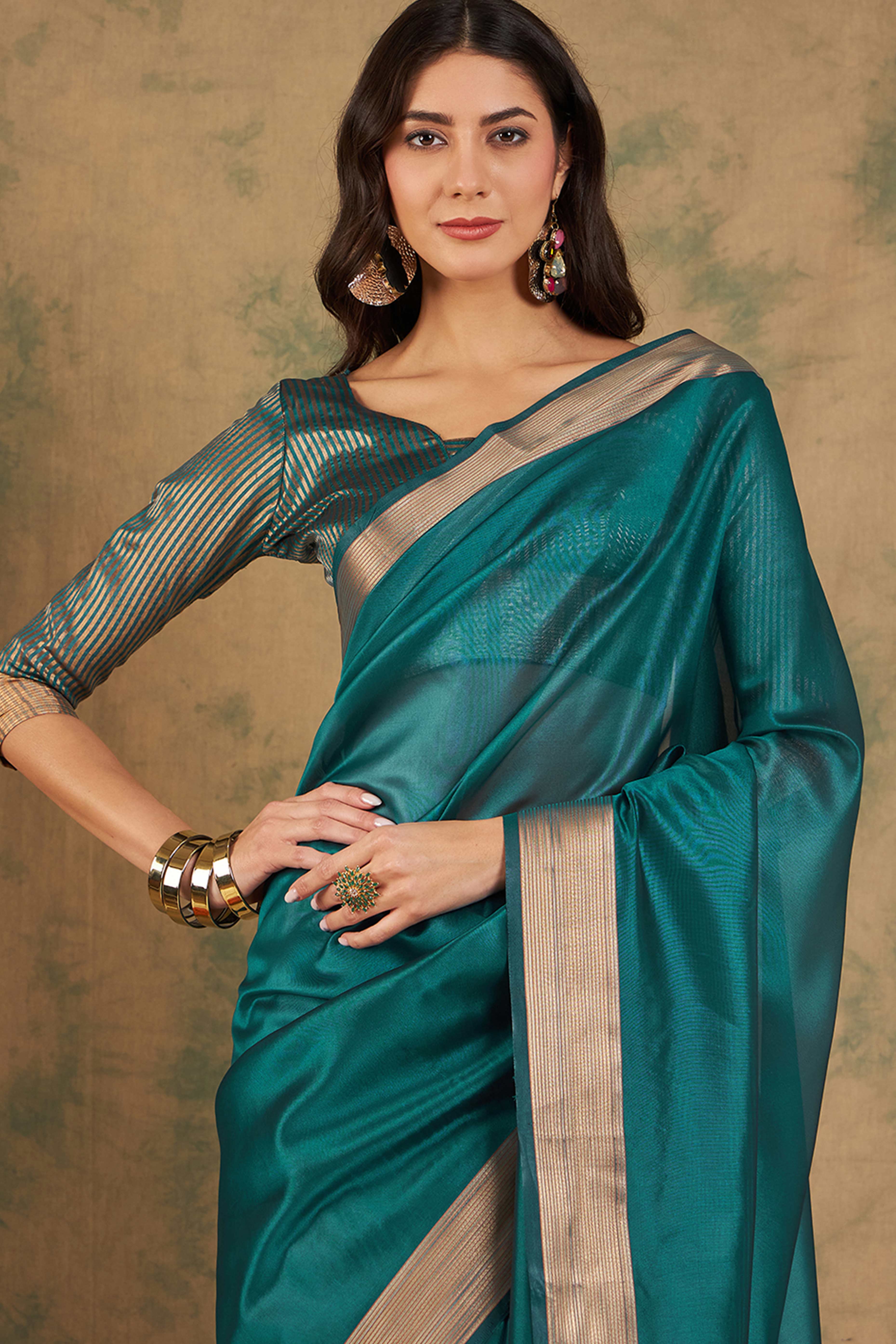 Teal Organza Saree In Organza With Delicate Weaving Border And Tassel Details