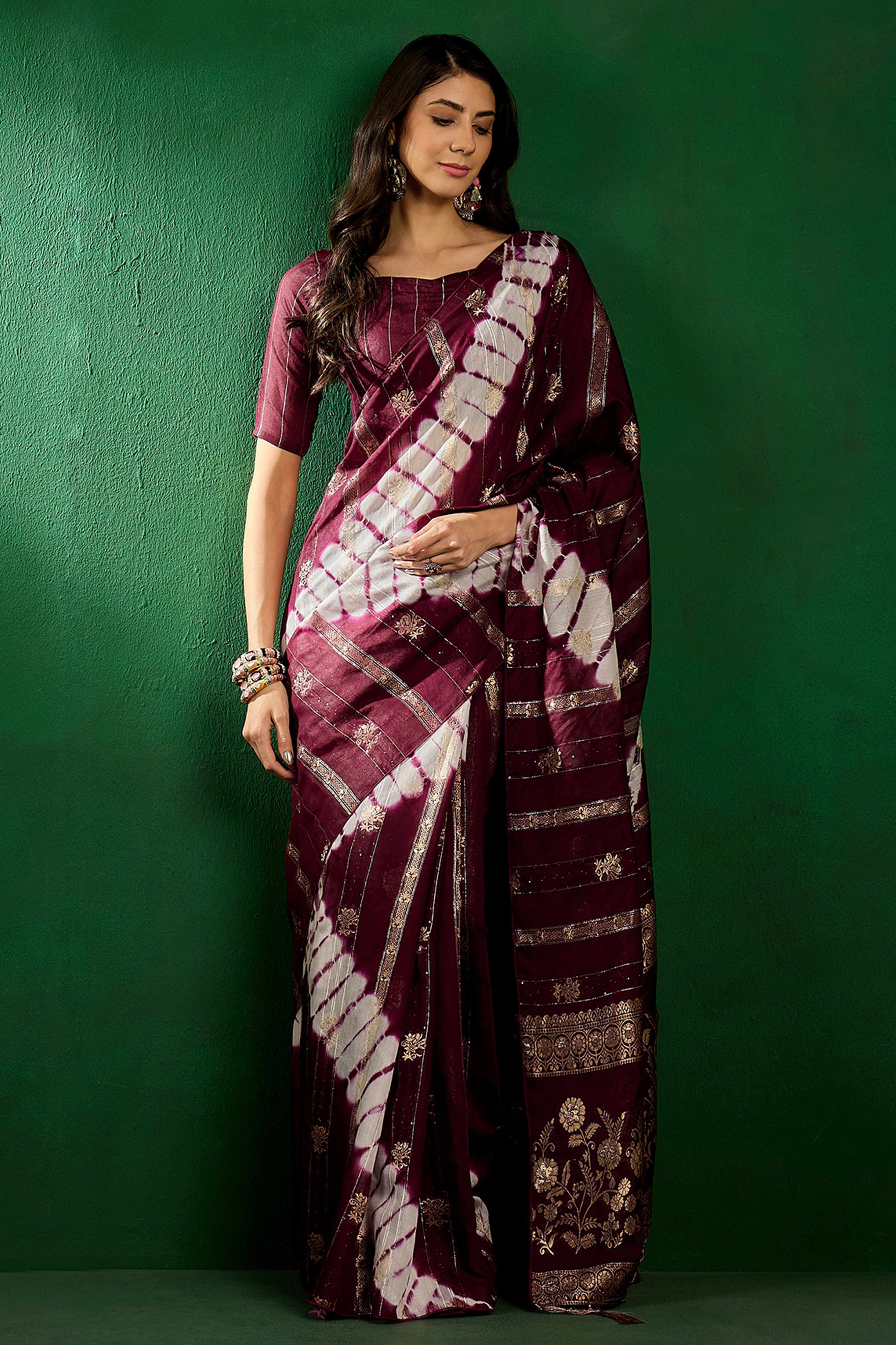 Wine Floral Woven Staple Cotton Blend Saree Highlighted With Sequins Embroidery & Tasselled Pallu