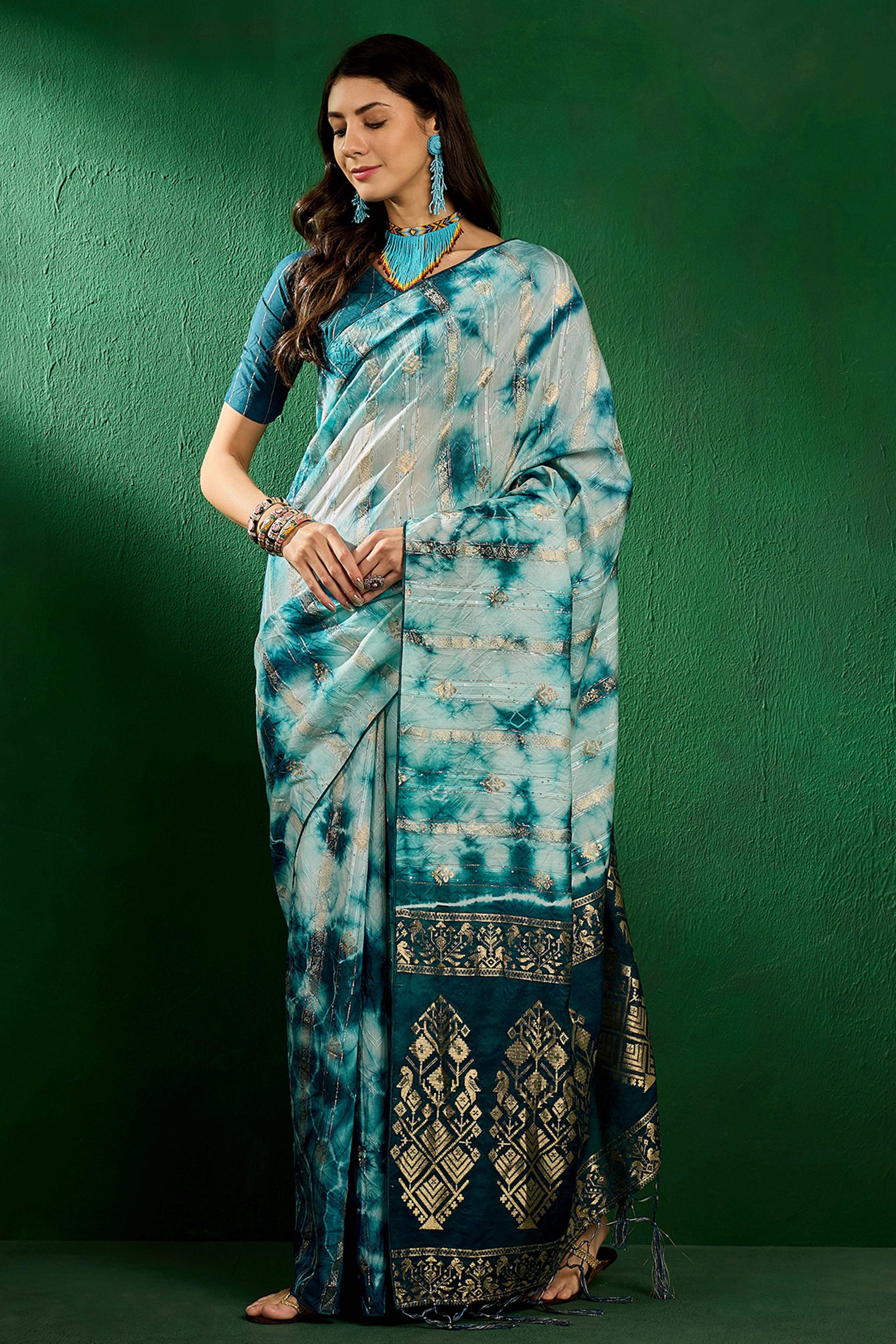 Floral Zari Woven Teal Saree In Cotton Blend With Sparkling Sequins & Elegant Tassel Pallu