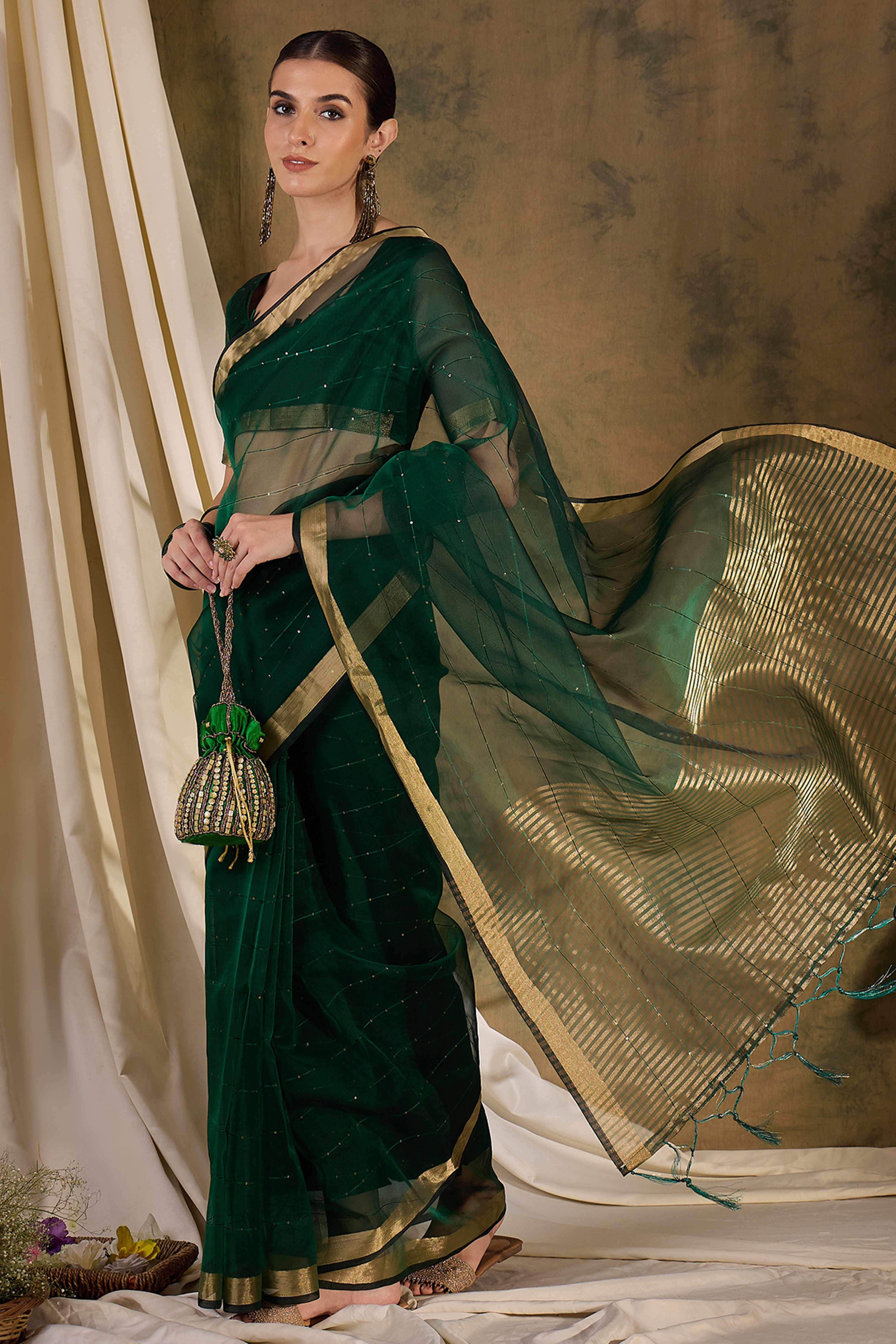 Green Organza Silk Saree Featuring Shimmering Sequins Embroidery & Elegant Tasselled Pallu
