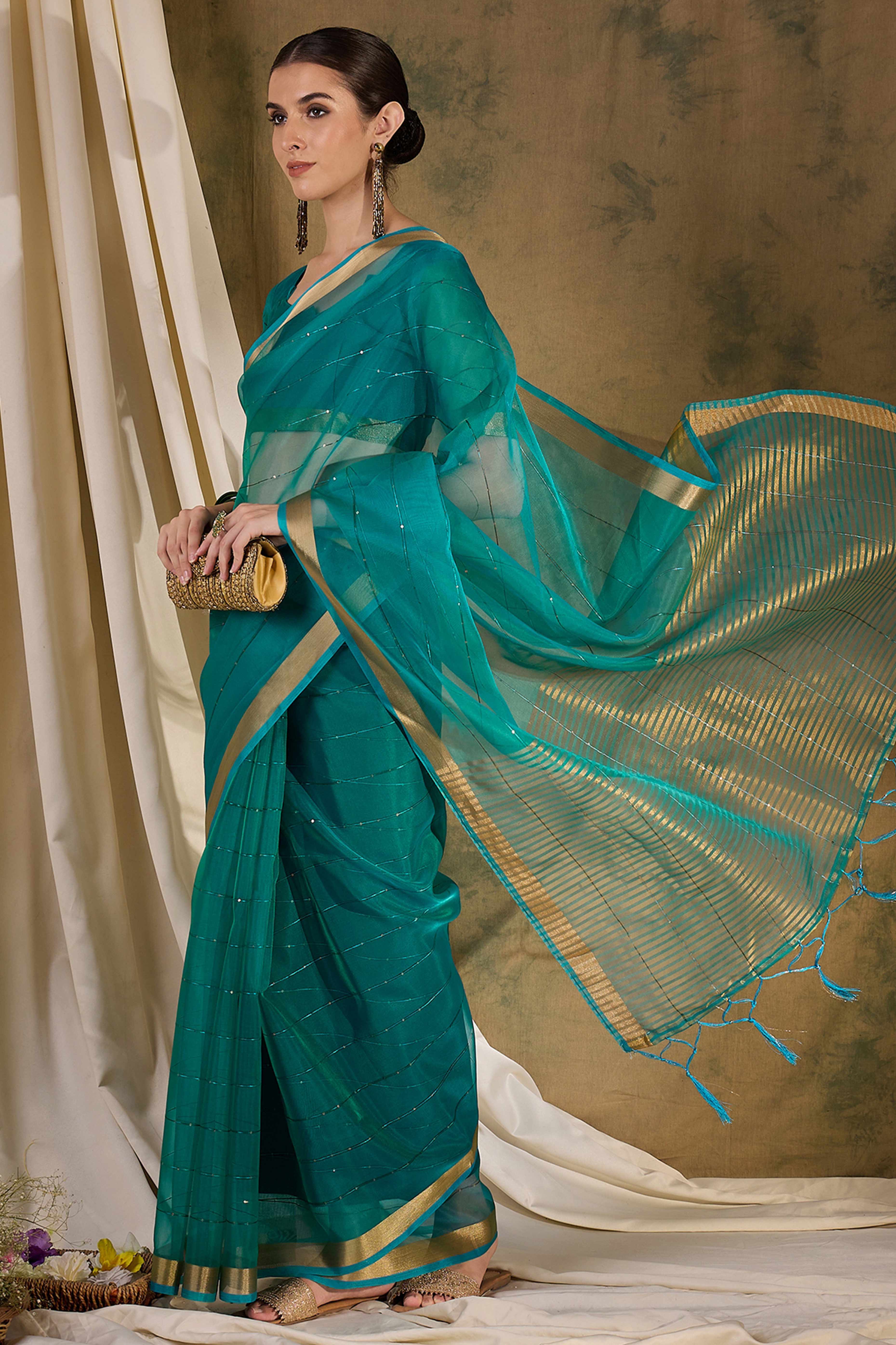 Teal Organza Silk Saree Featuring Shimmering Sequins Embroidery & Elegant Tasselled Pallu