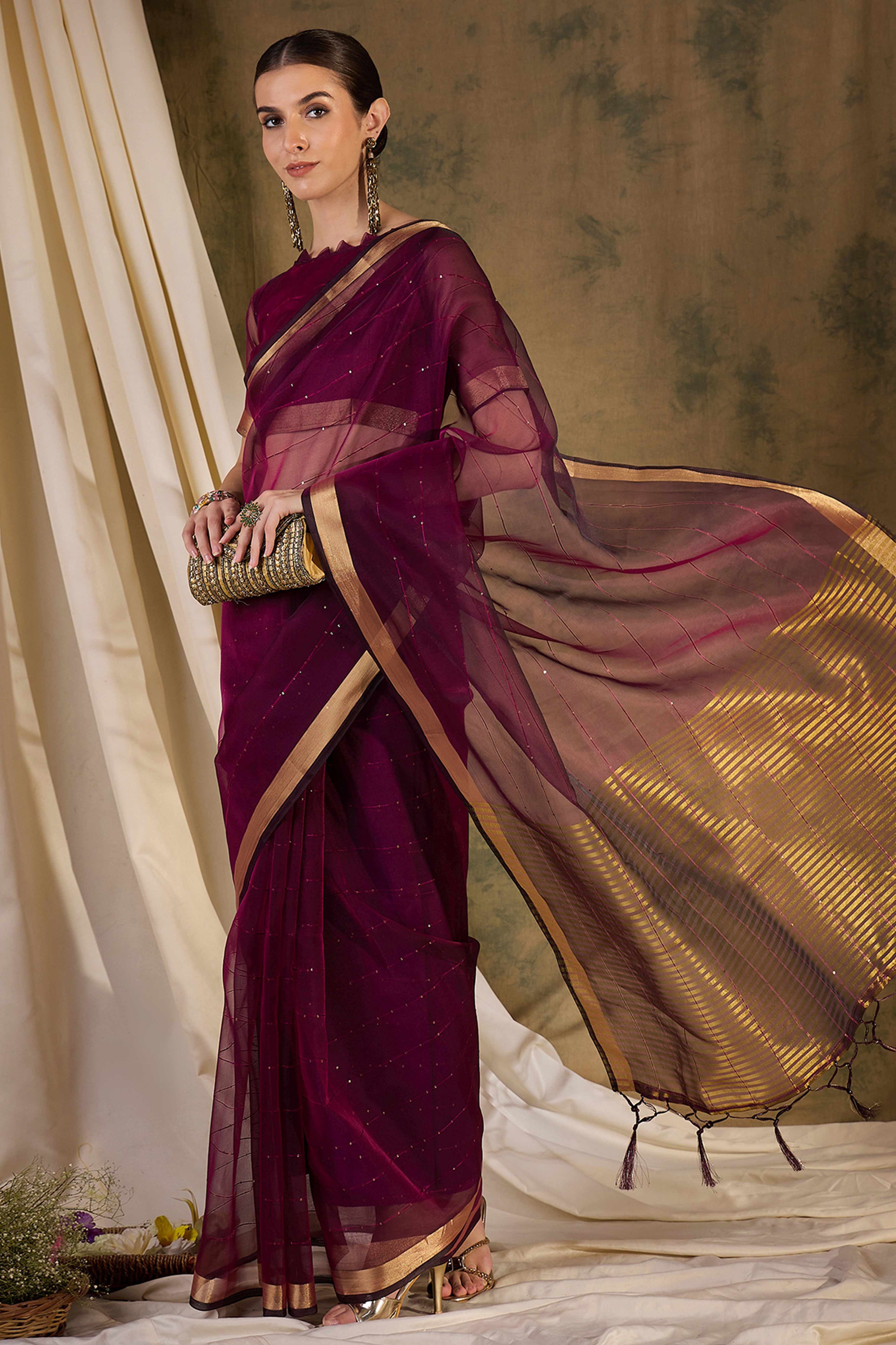 Wine Organza Silk Saree Featuring Shimmering Sequins Embroidery & Elegant Tasselled Pallu