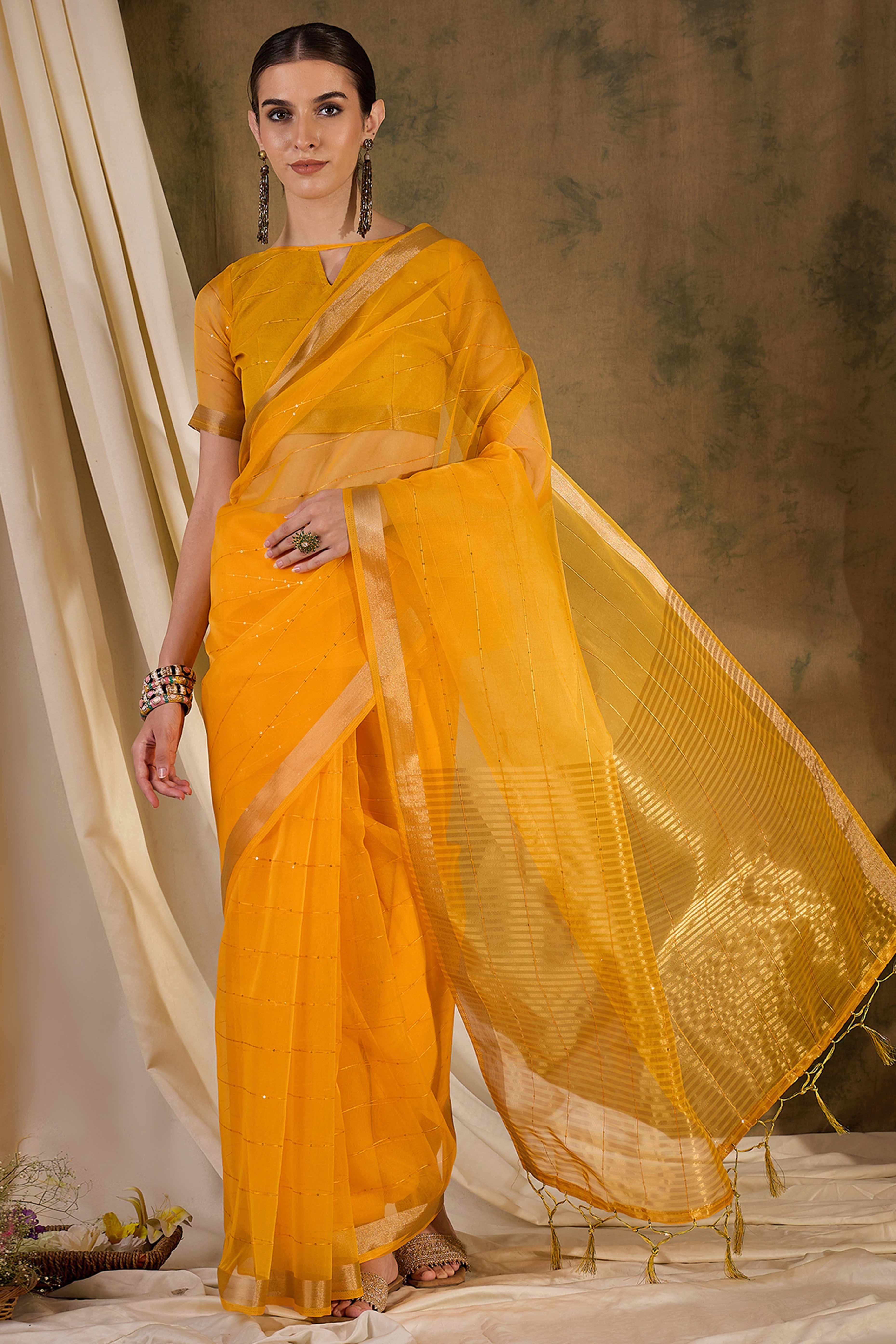Yellow Organza Silk Saree Featuring Shimmering Sequins Embroidery & Elegant Tasselled Pallu