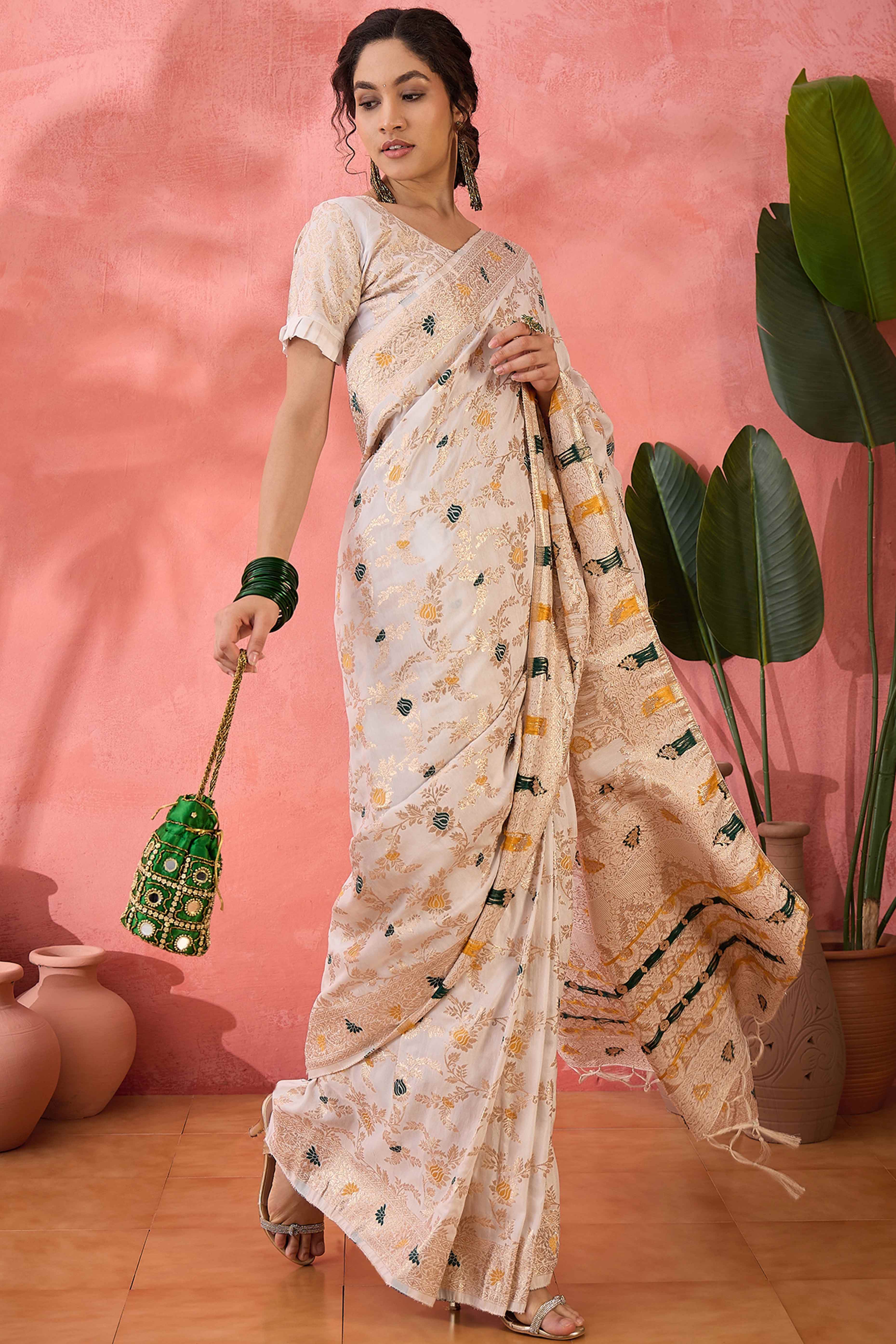Offwhite Cotton Meena Jacquard Saree Featuring Intricate Floral Weaving & Tassels On The Pallu