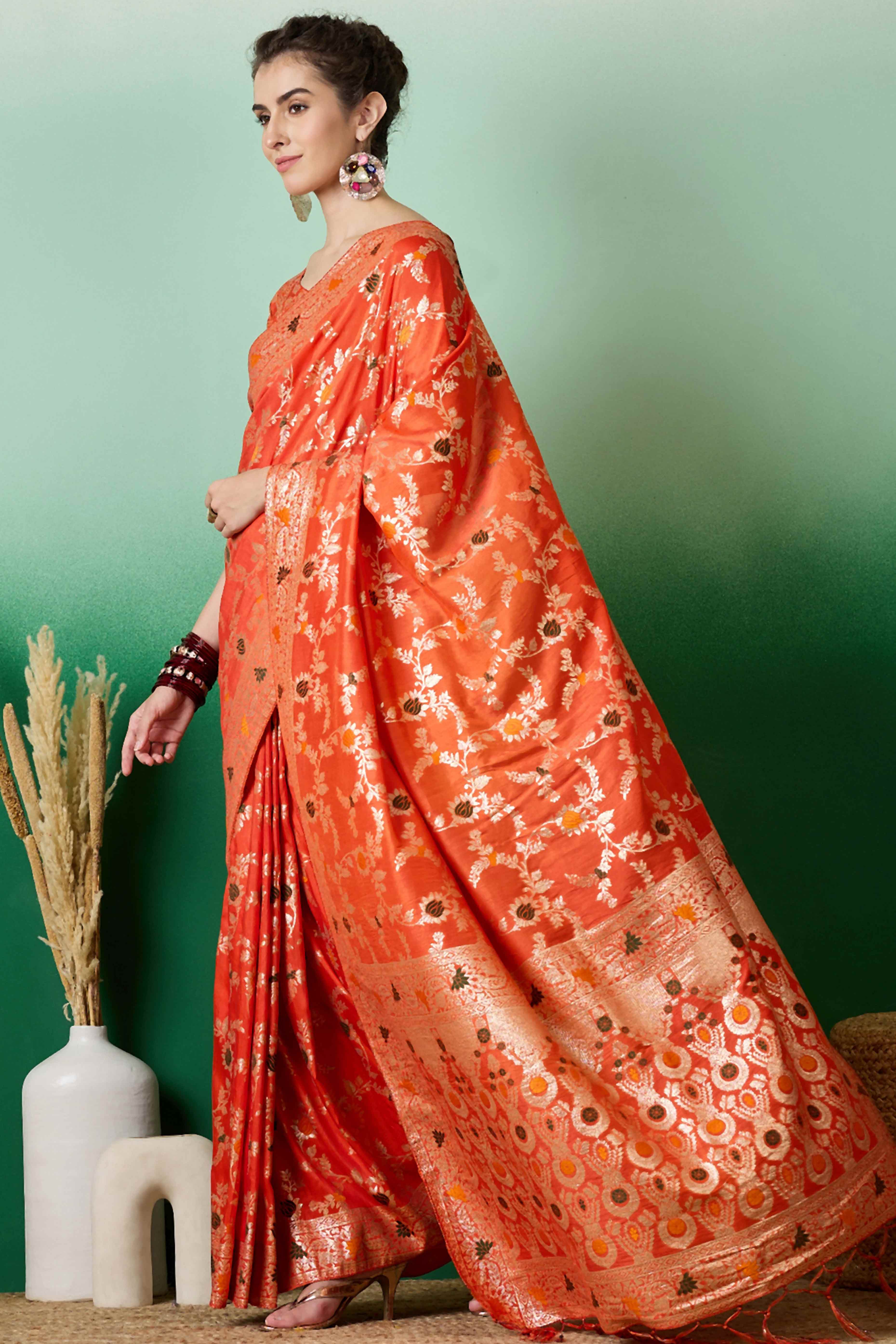 Orange Cotton Meena jacquard Saree Featuring Intricate Floral Weaving & Playful Tassels On The Pallu
