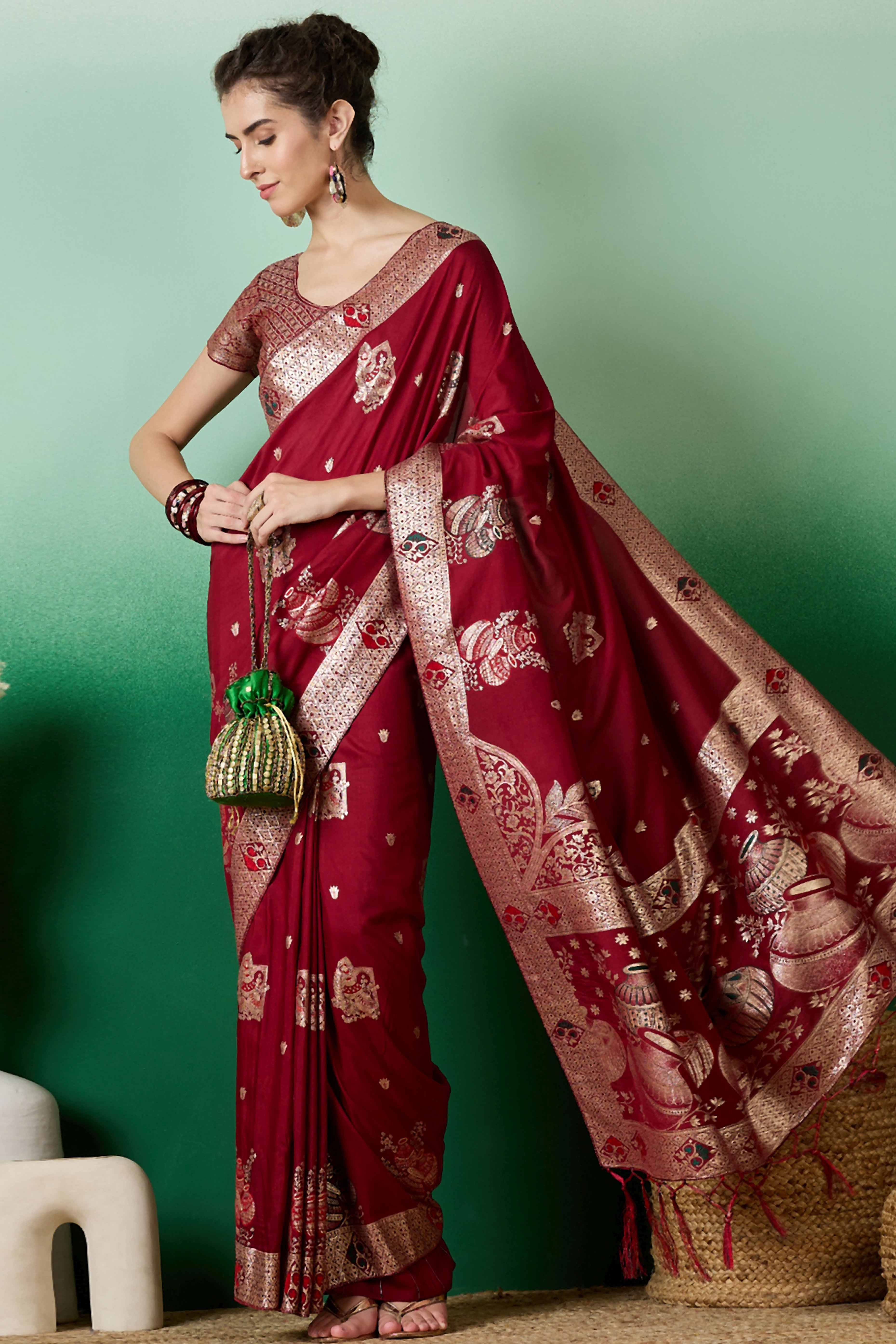 Maroon Cotton Blend Saree Adorned With Floral Zari Weaving & Soft Tassel Accents