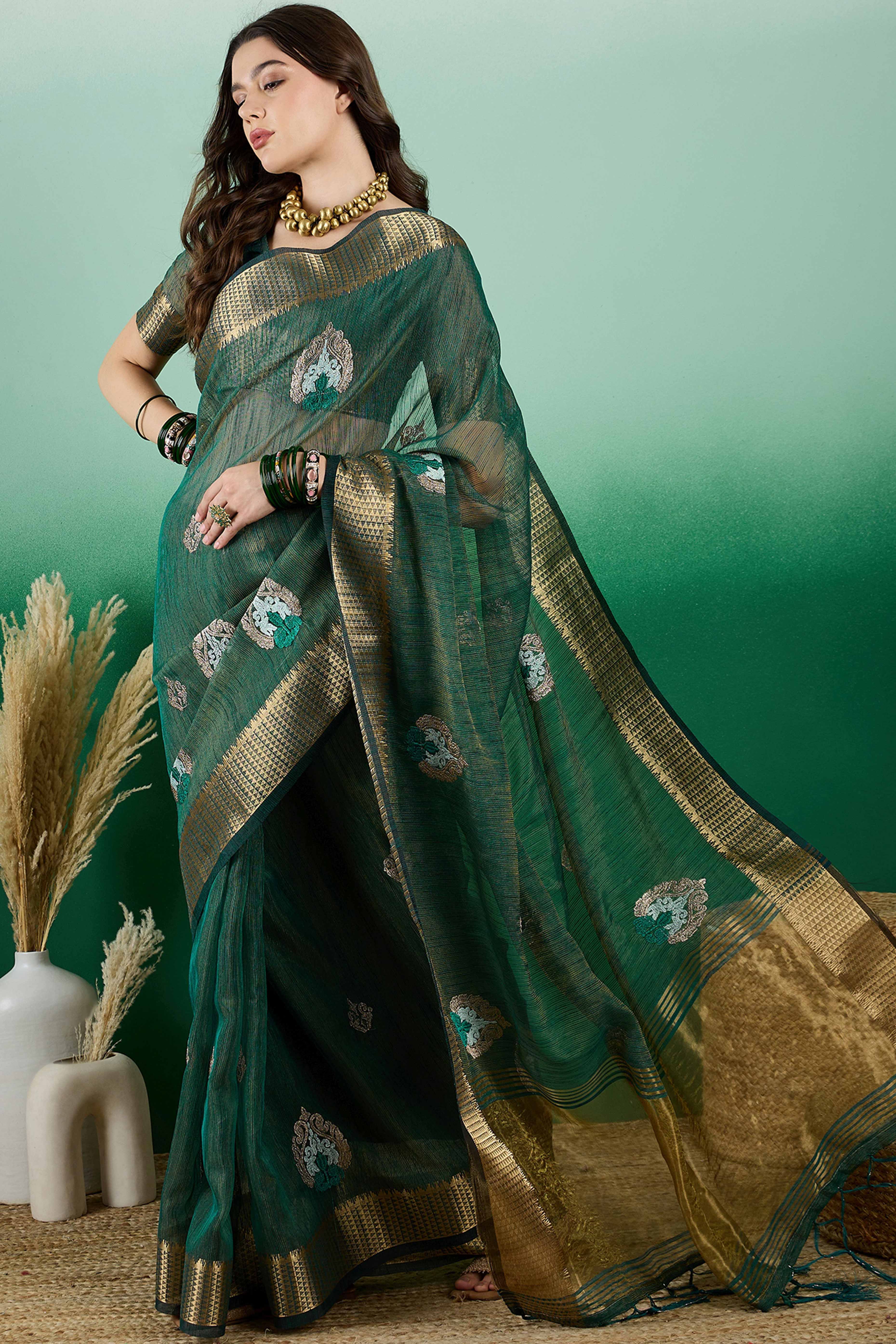 Green Khadi Organza Saree Adorned With Elegant Embroidery & Tassel Pallu