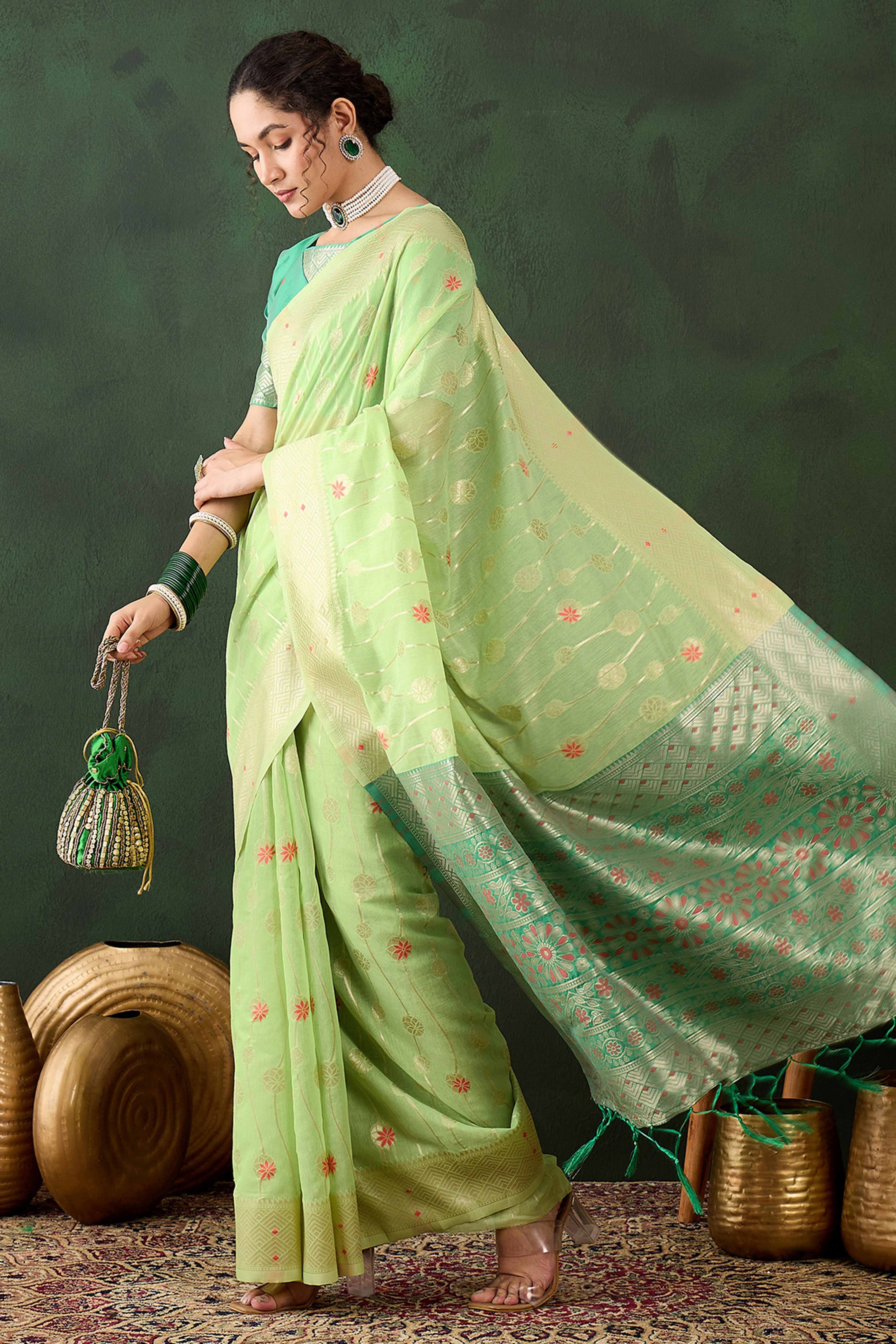 Green Cotton Blend Saree Adorned With Intricate Floral Zari Weaving & A Stylish Tassel Pallu