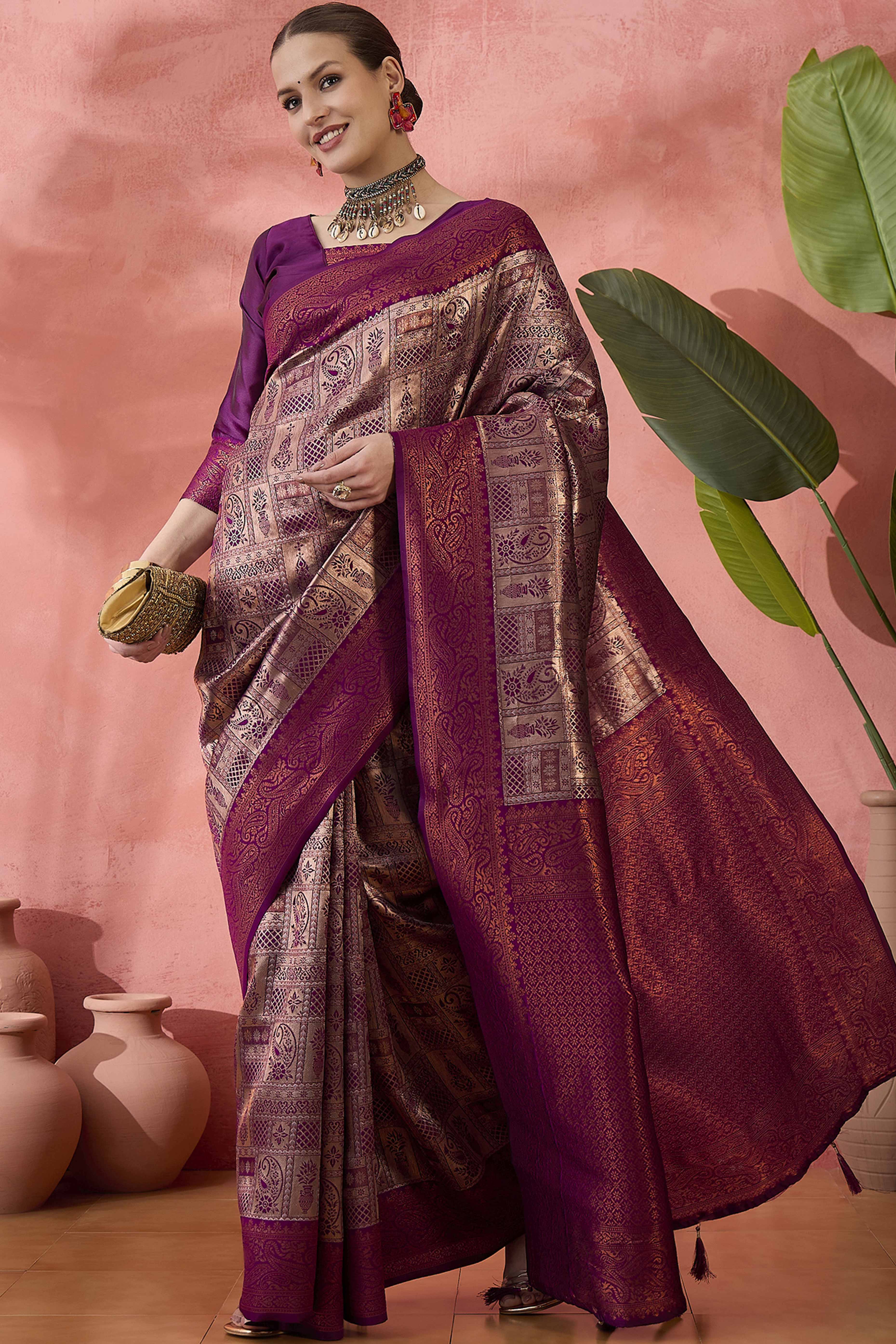 Wine Woven Poly Silk Blend Saree Featuring Floral & Paisley Motifs With Tassel Accents
