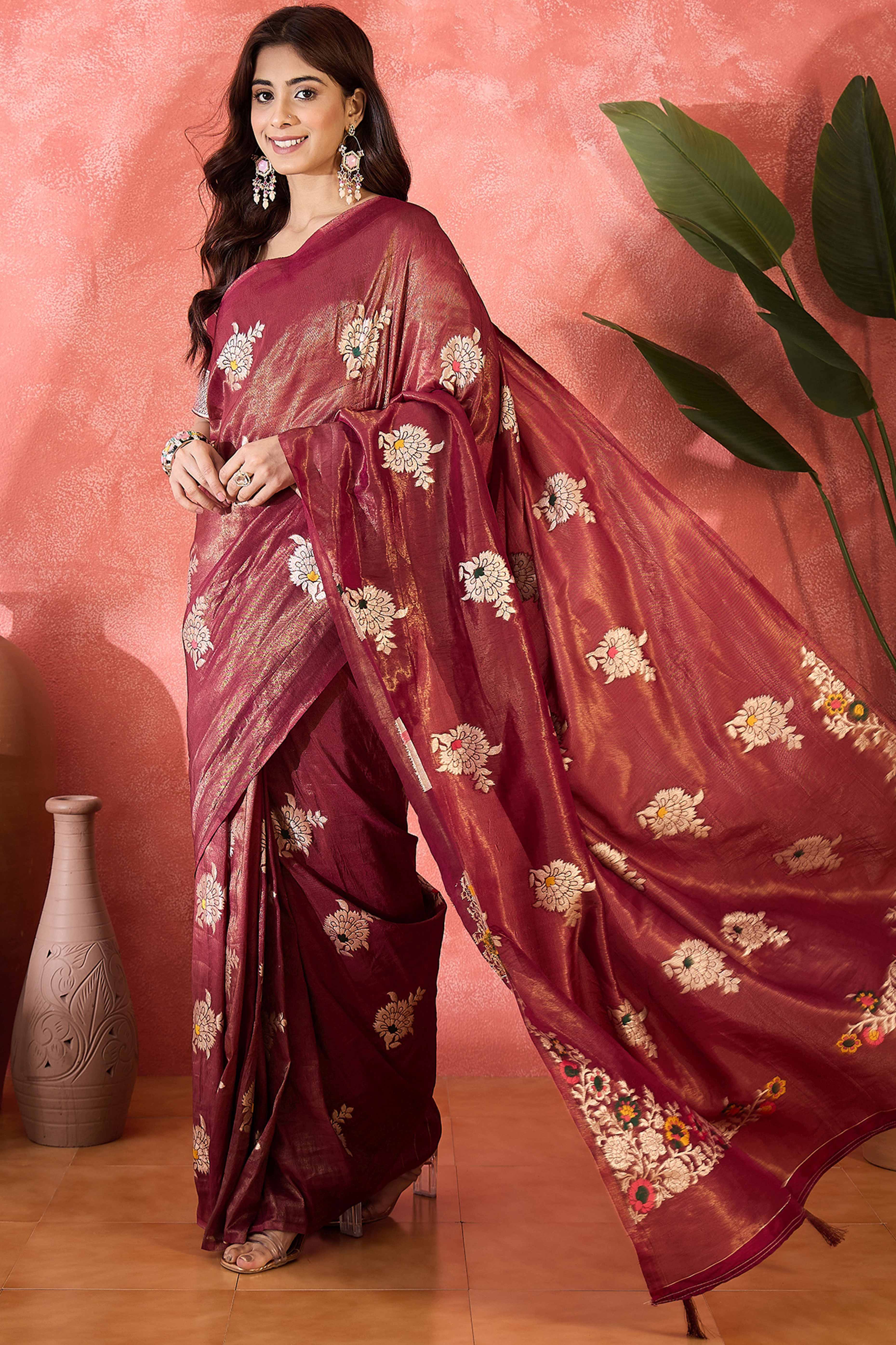 Wine Shimmer Saree Featuring Intricate Floral Zari Weaving & Tassel Finish
