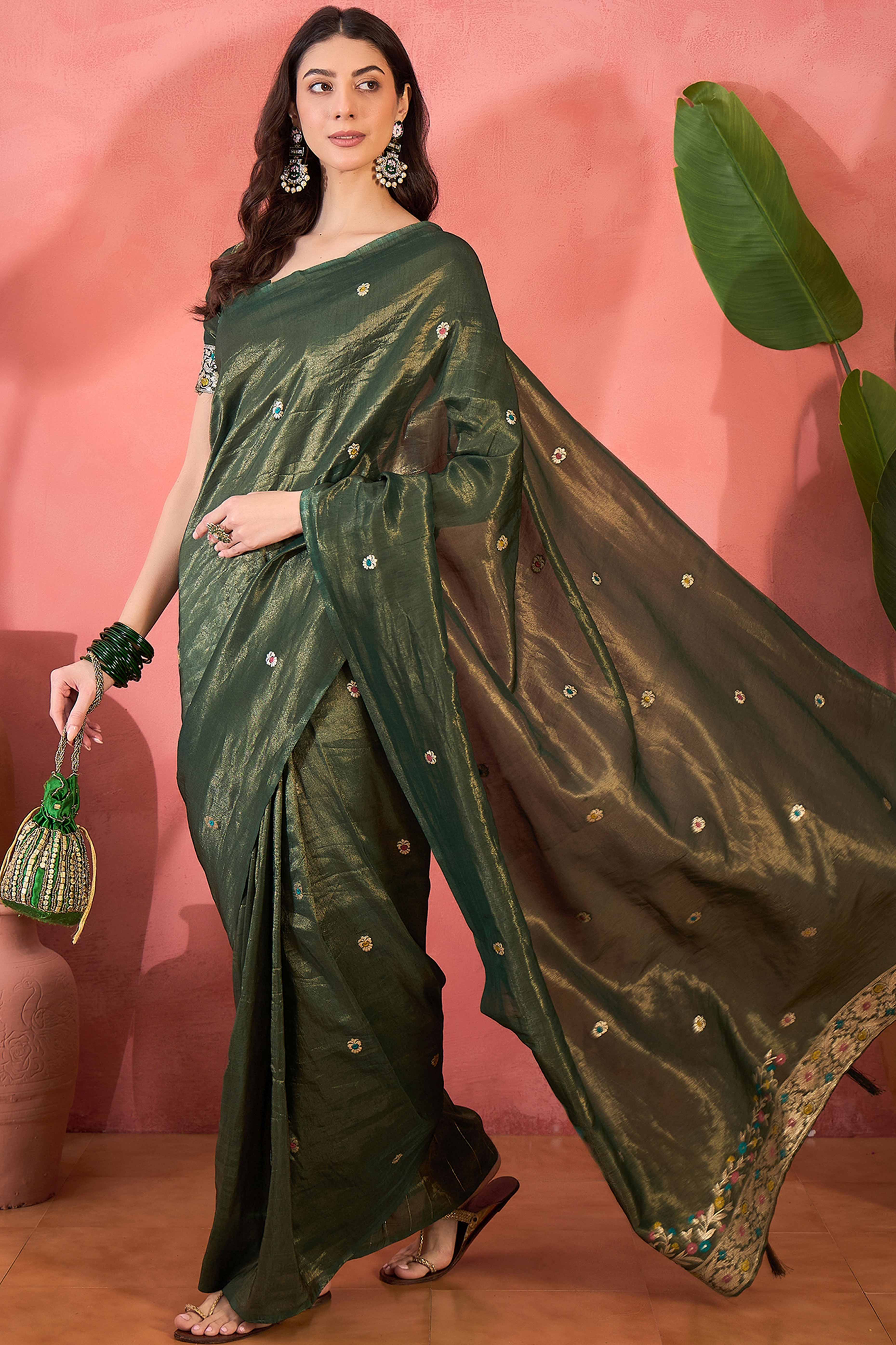 Green Zari Woven Shimmer Saree With Floral Motifs & Flowing Tassel Pallu