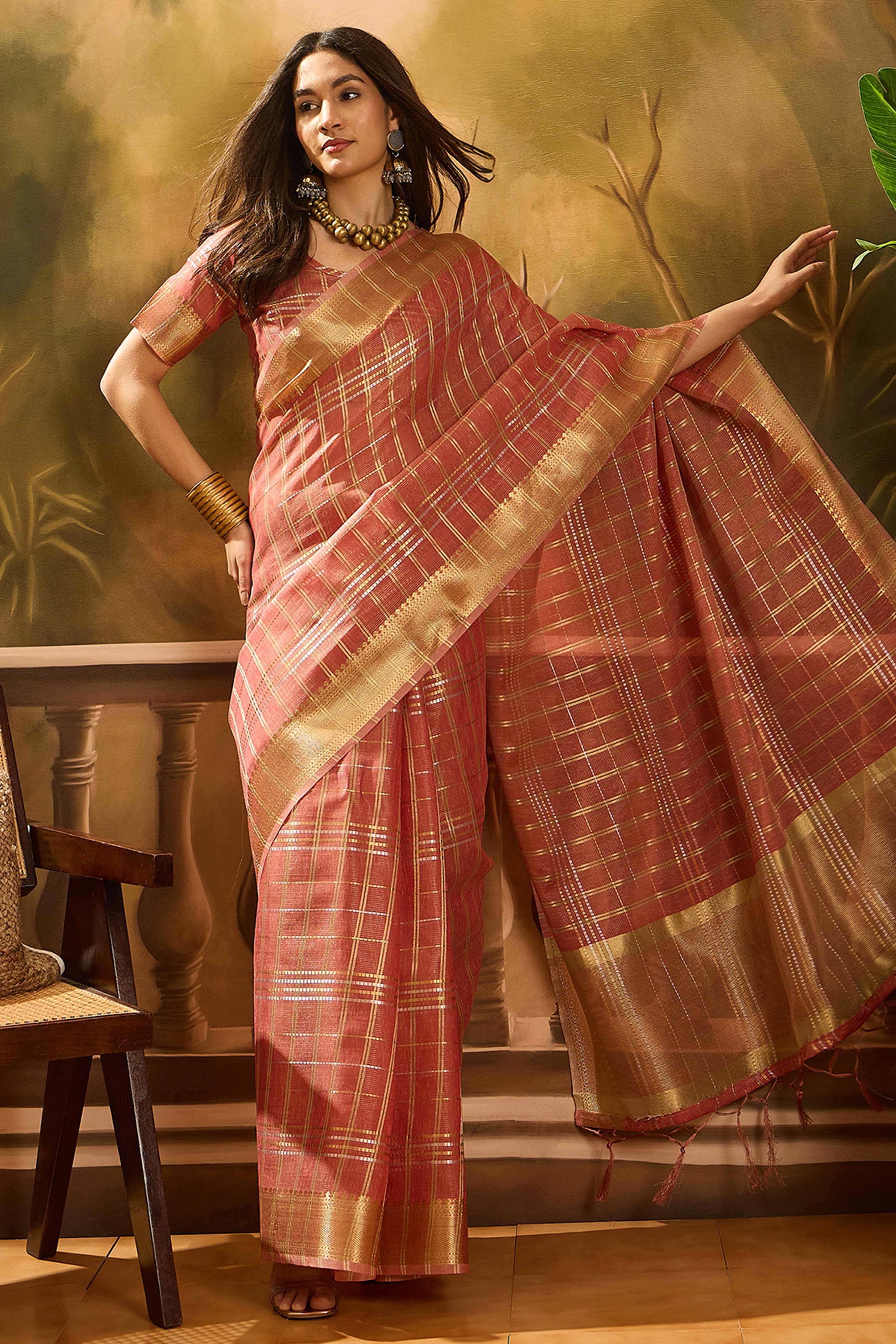 Peach Zari Woven Khadi Organza Saree Featuring Classic Checks & Tassel Detailing