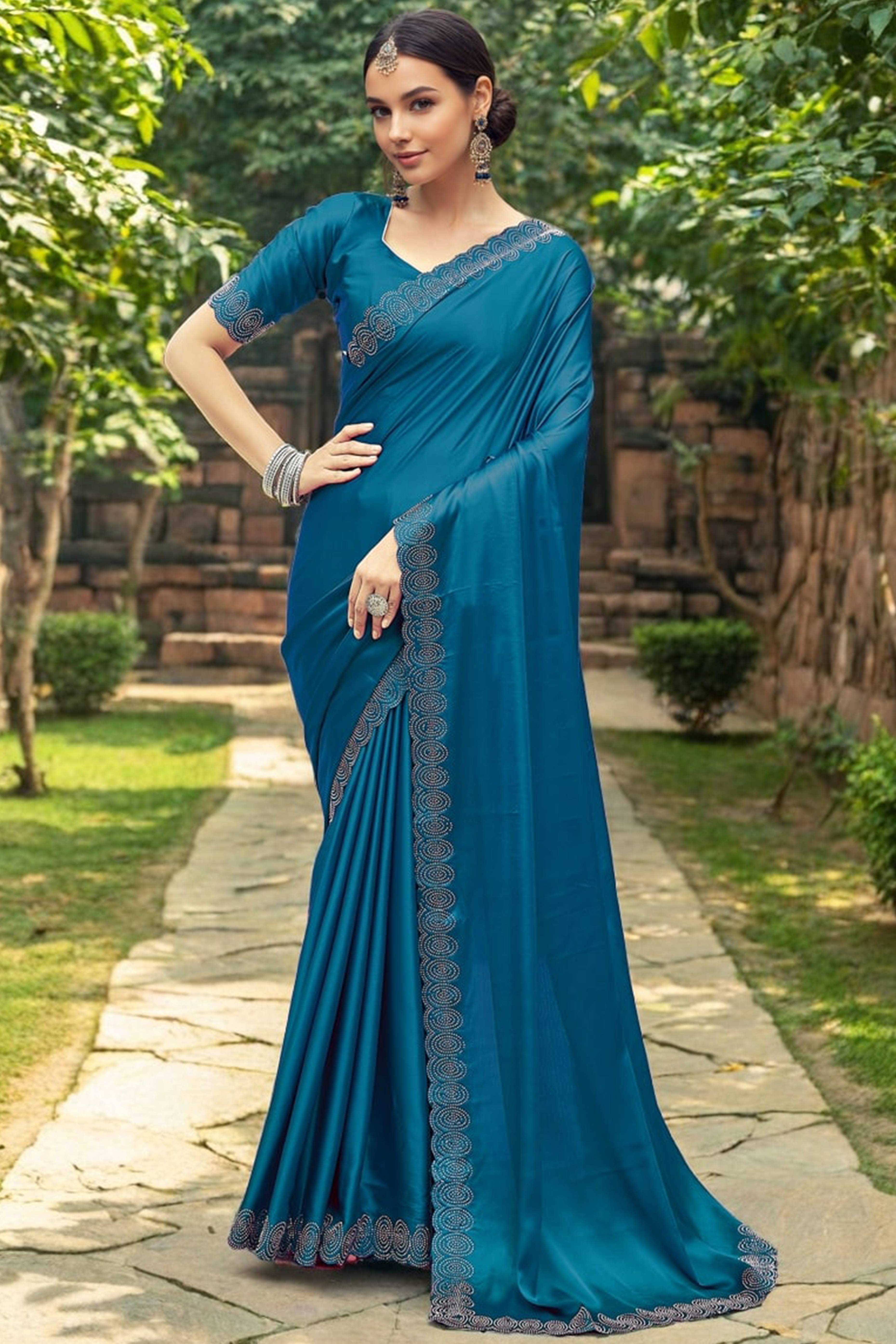 Teal Blue Solid Rangoli Dola Silk Saree Featuring Sparkling Swarovski Work Border