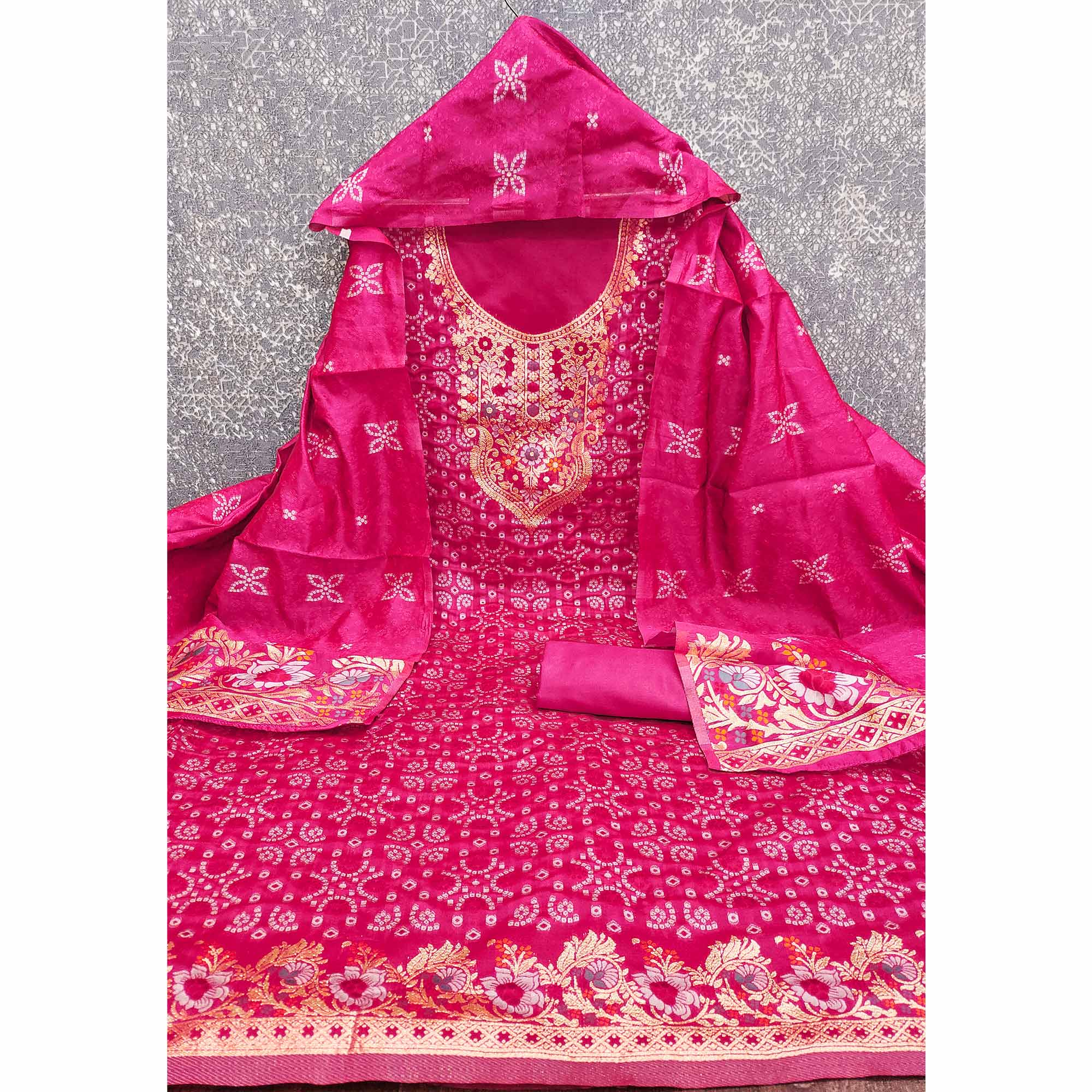 Rani Pink Banarasi Silk Jacquard Dress Material Adorned With Intricate Floral Zari Weaving