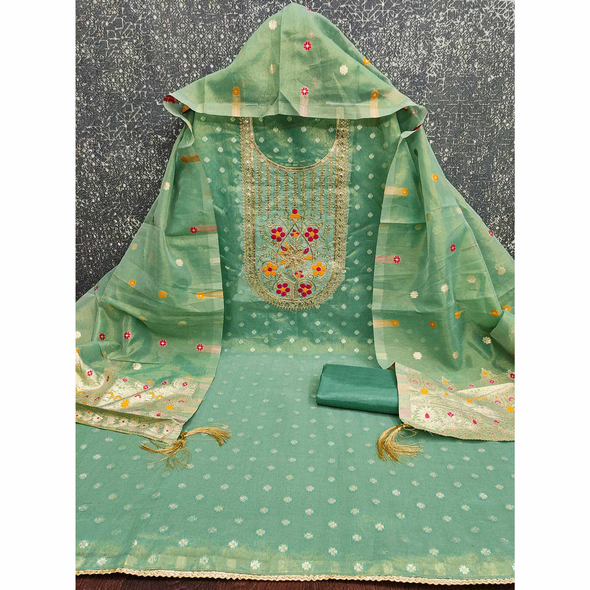 Green Shimmer Dress Material Adorned With Graceful Floral Weaving & Delicate Sequins Embroidery