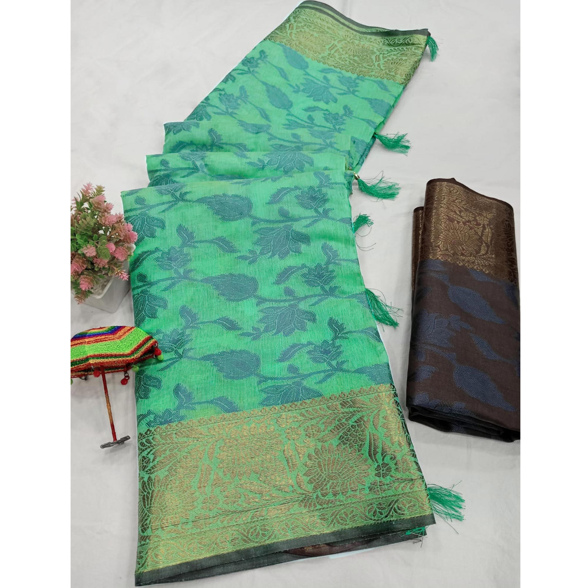 Turquoise Floral Woven Cotton Silk Saree With Tassels