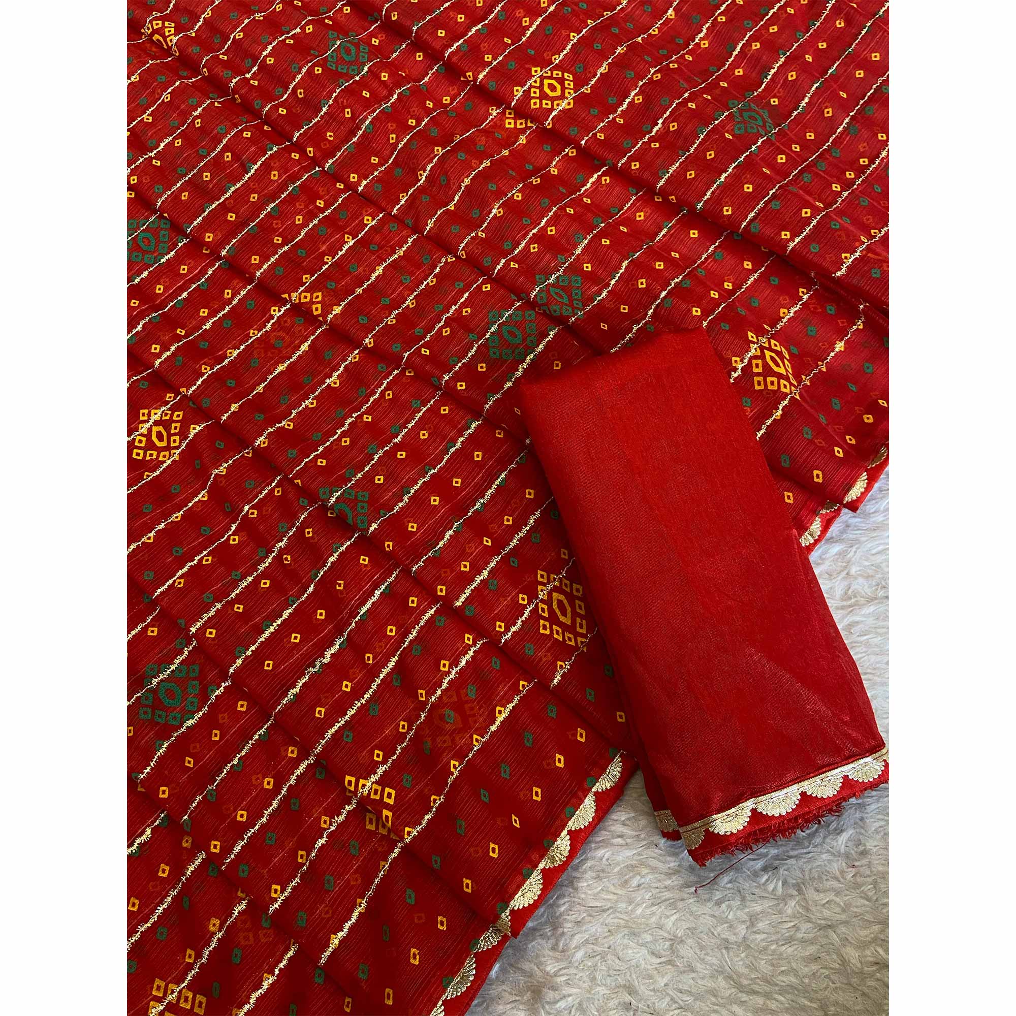 Red Bandhani Printed Chiffon Saree with Graceful Touches of Zari Work