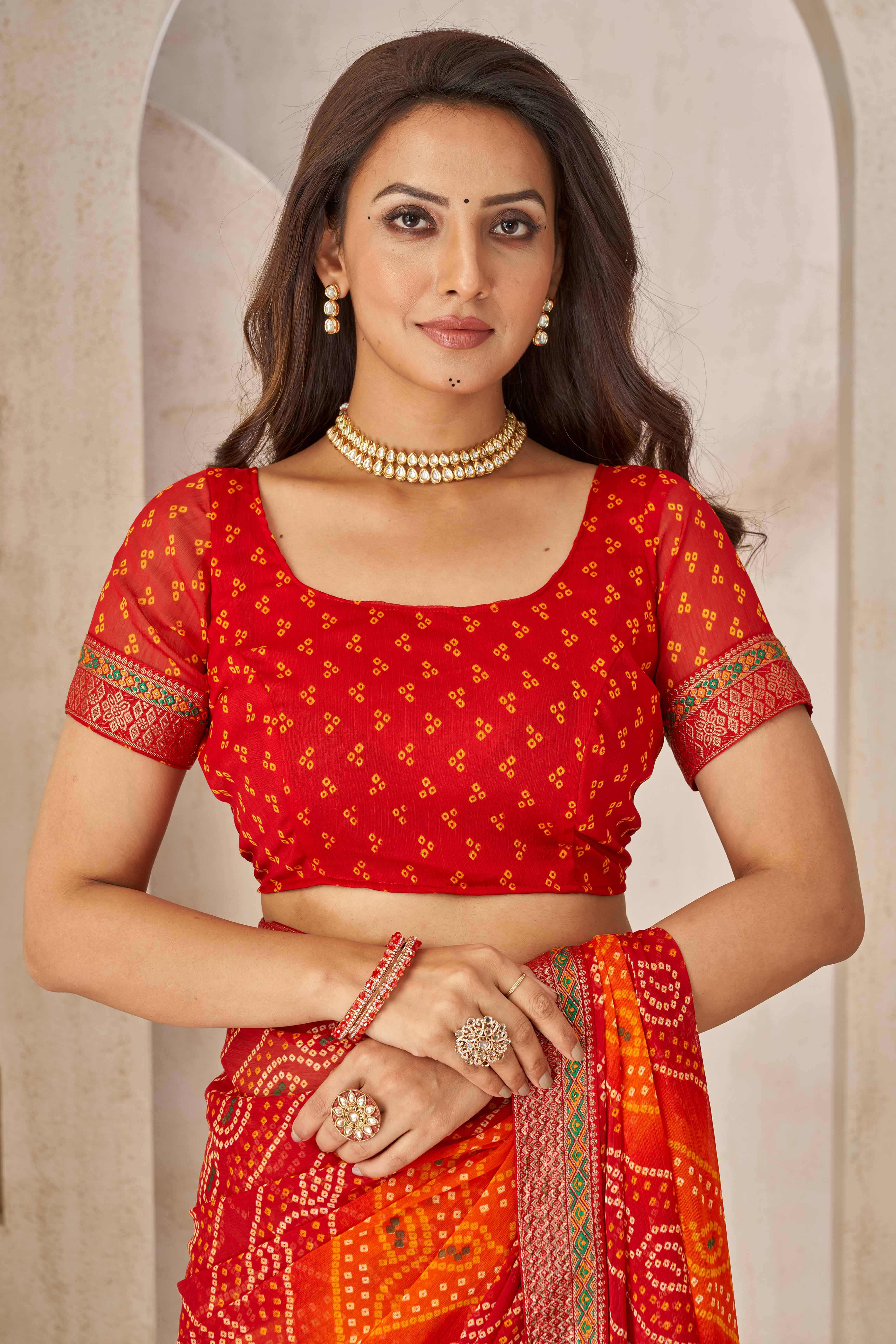 Maroon & Orange Bandhani Printed Chiffon Saree Enhanced with Delicate Lace Border Work