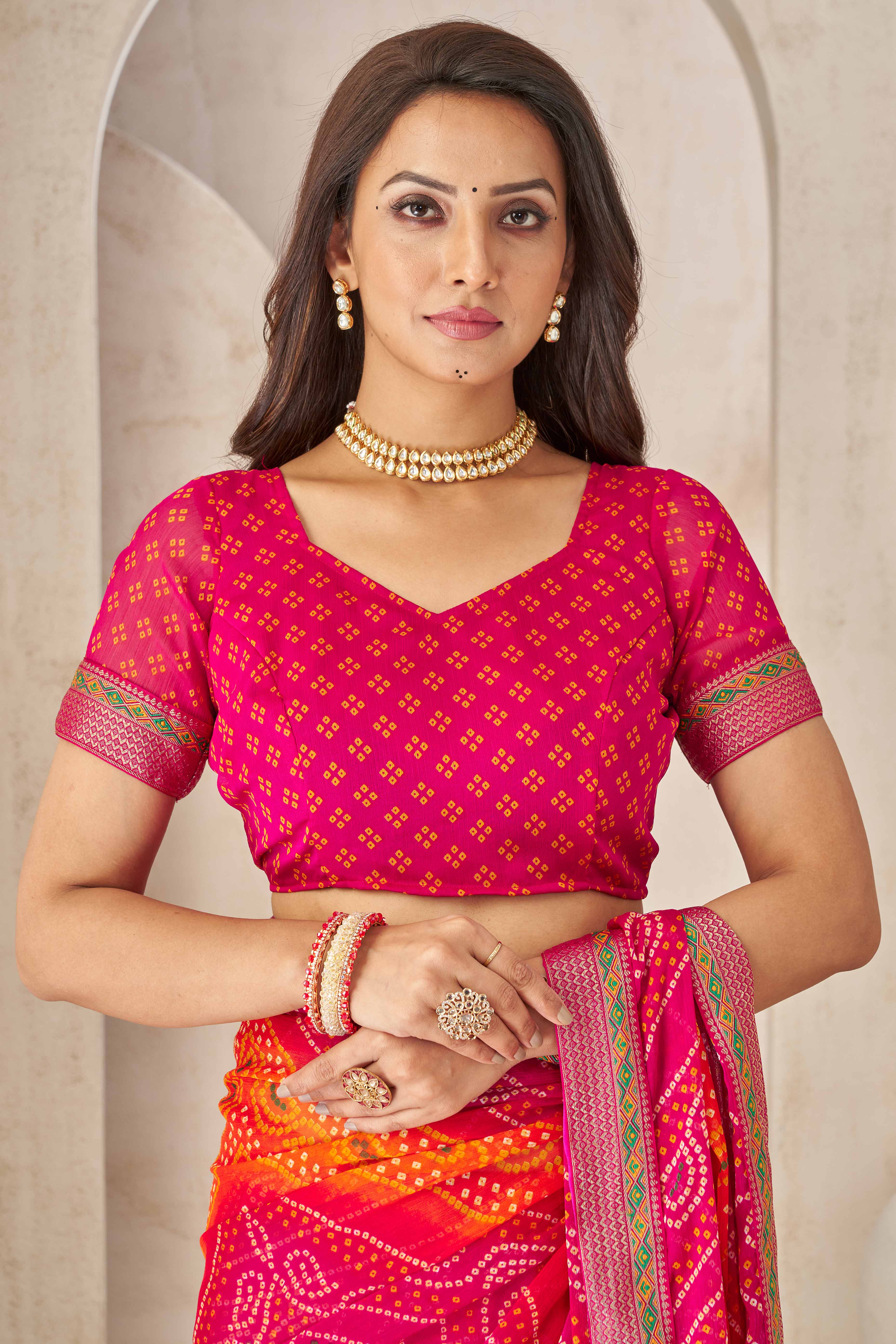 Magenta Bandhani Printed Chiffon Saree Enhanced with Delicate Lace Border Work