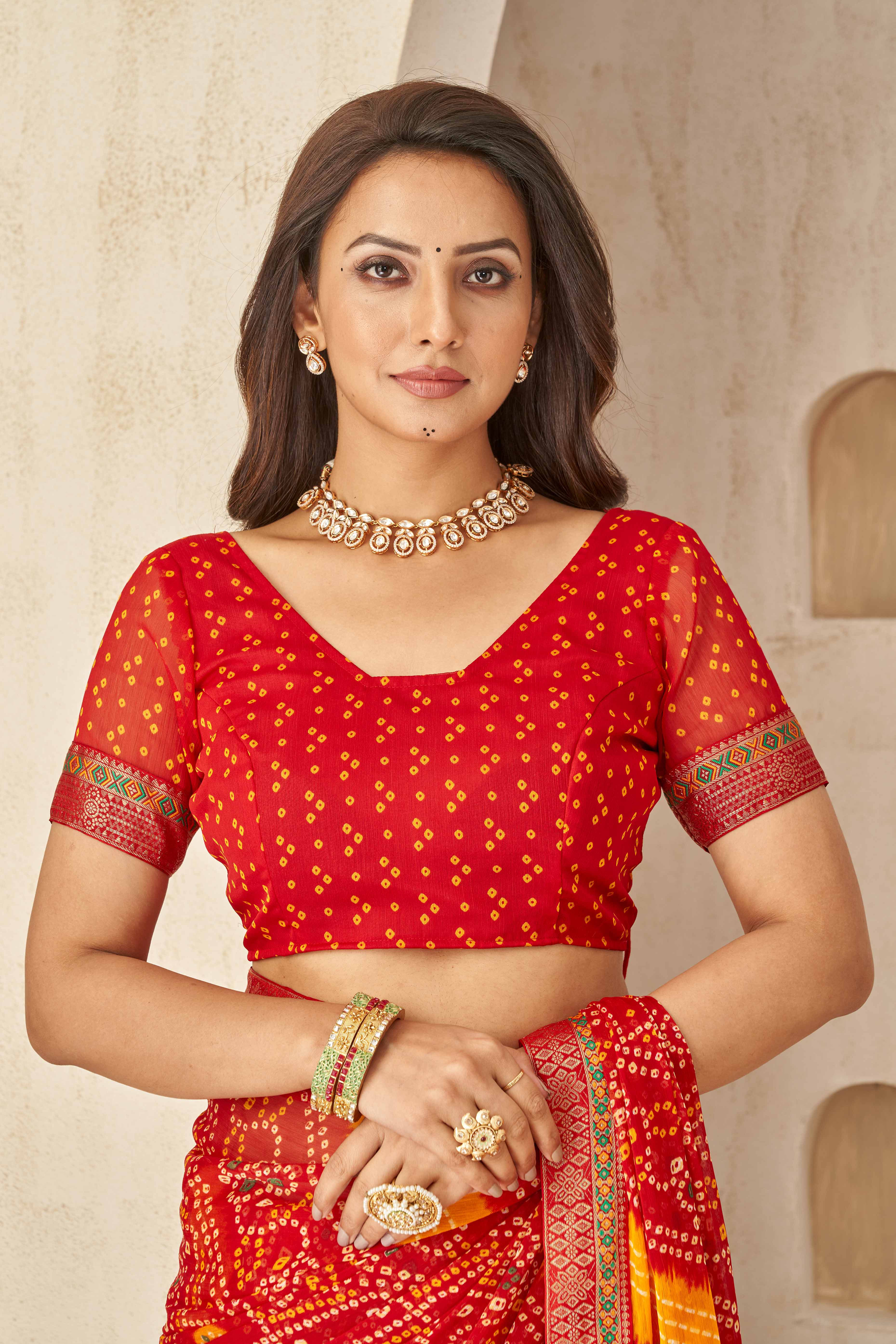 Red & Mustard Bandhani Printed Chiffon Saree Enhanced with Delicate Lace Border Work