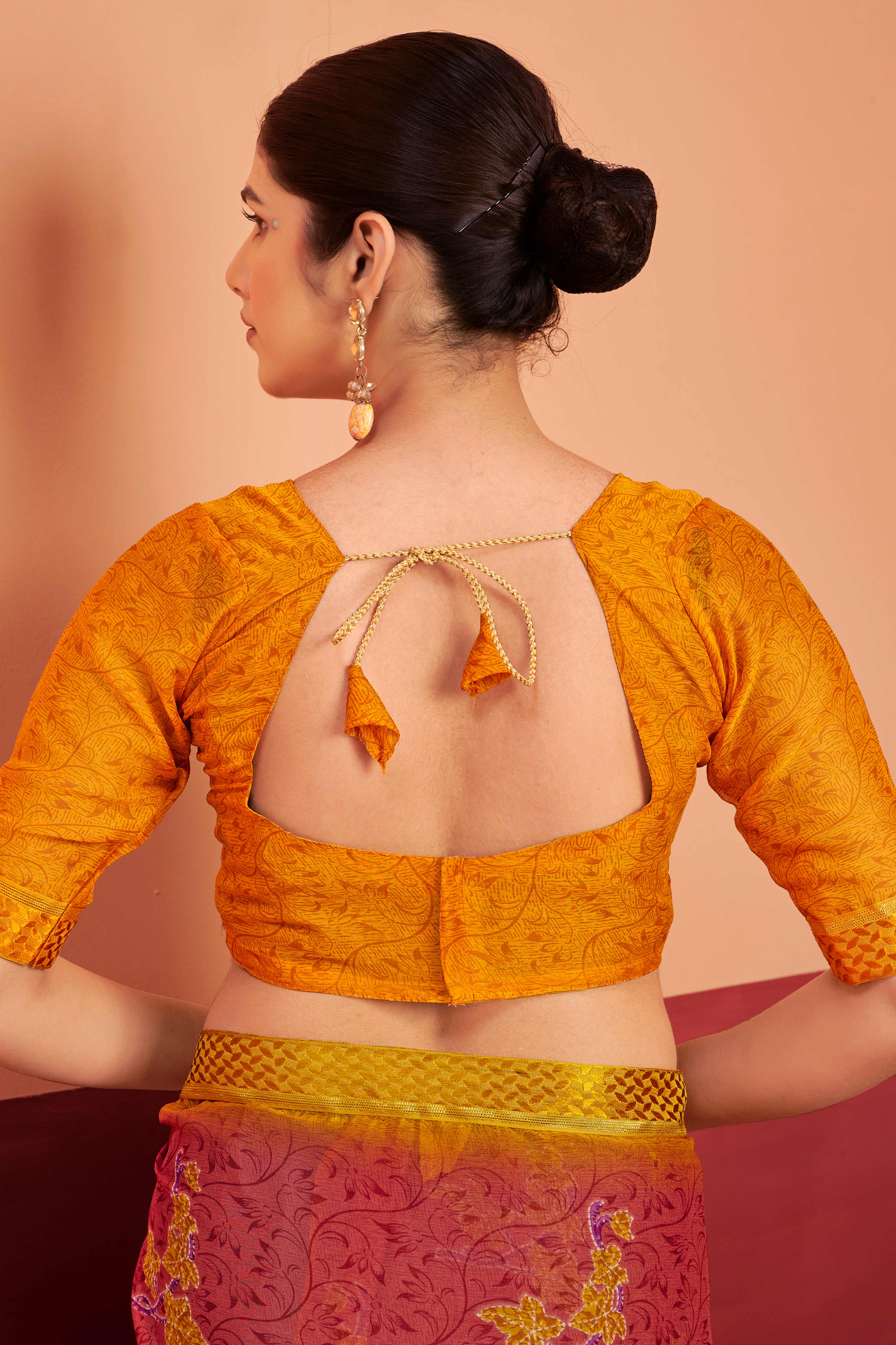 Brick Red Chiffon Saree Featuring Delicate Floral Prints & A Graceful Lace Border