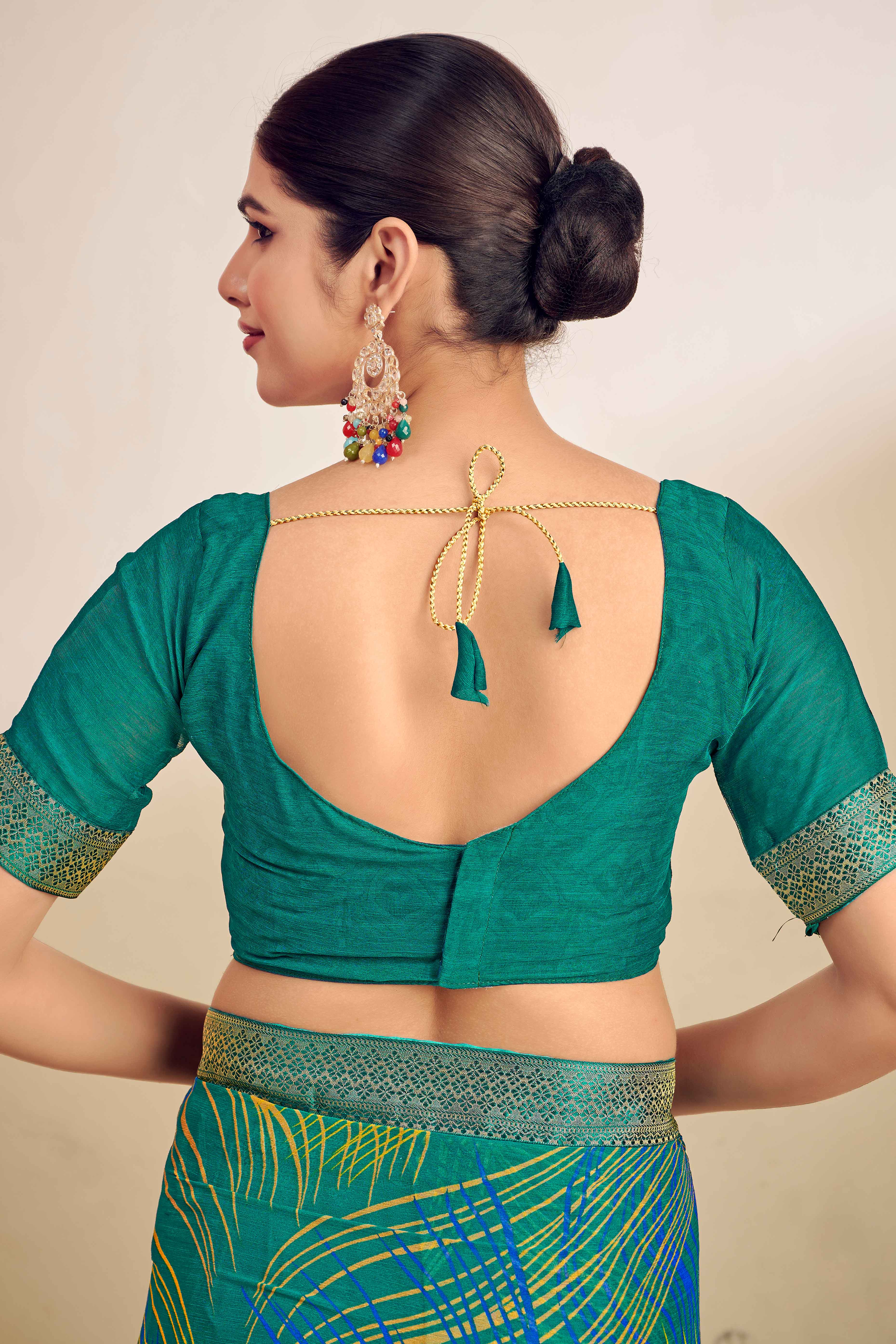 Teal Chiffon Saree Adorned With Artistic Print & Finely Crafted Woven Lace Border