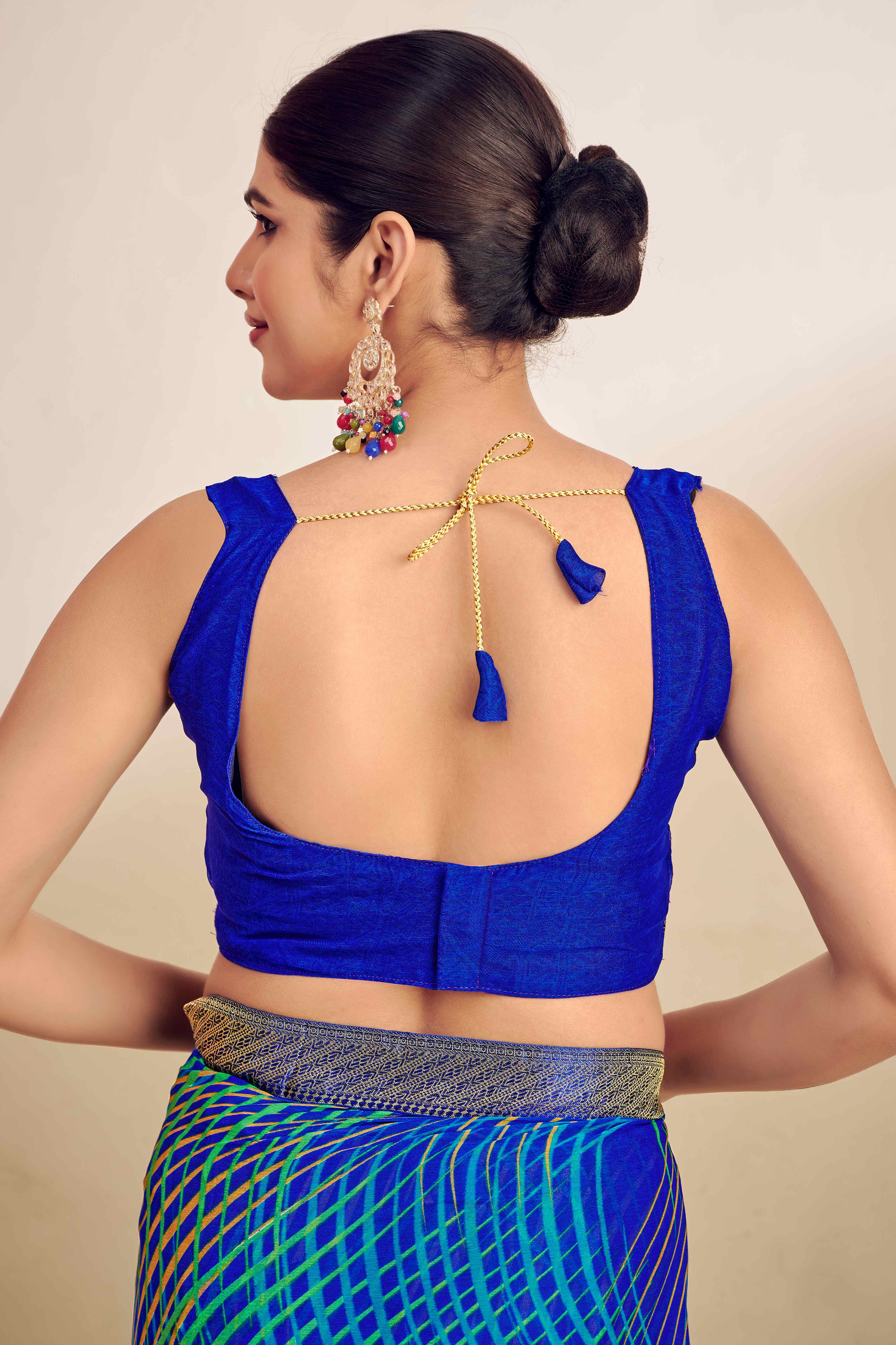 Blue Chiffon Saree Adorned With Artistic Print & Finely Crafted Woven Lace Border
