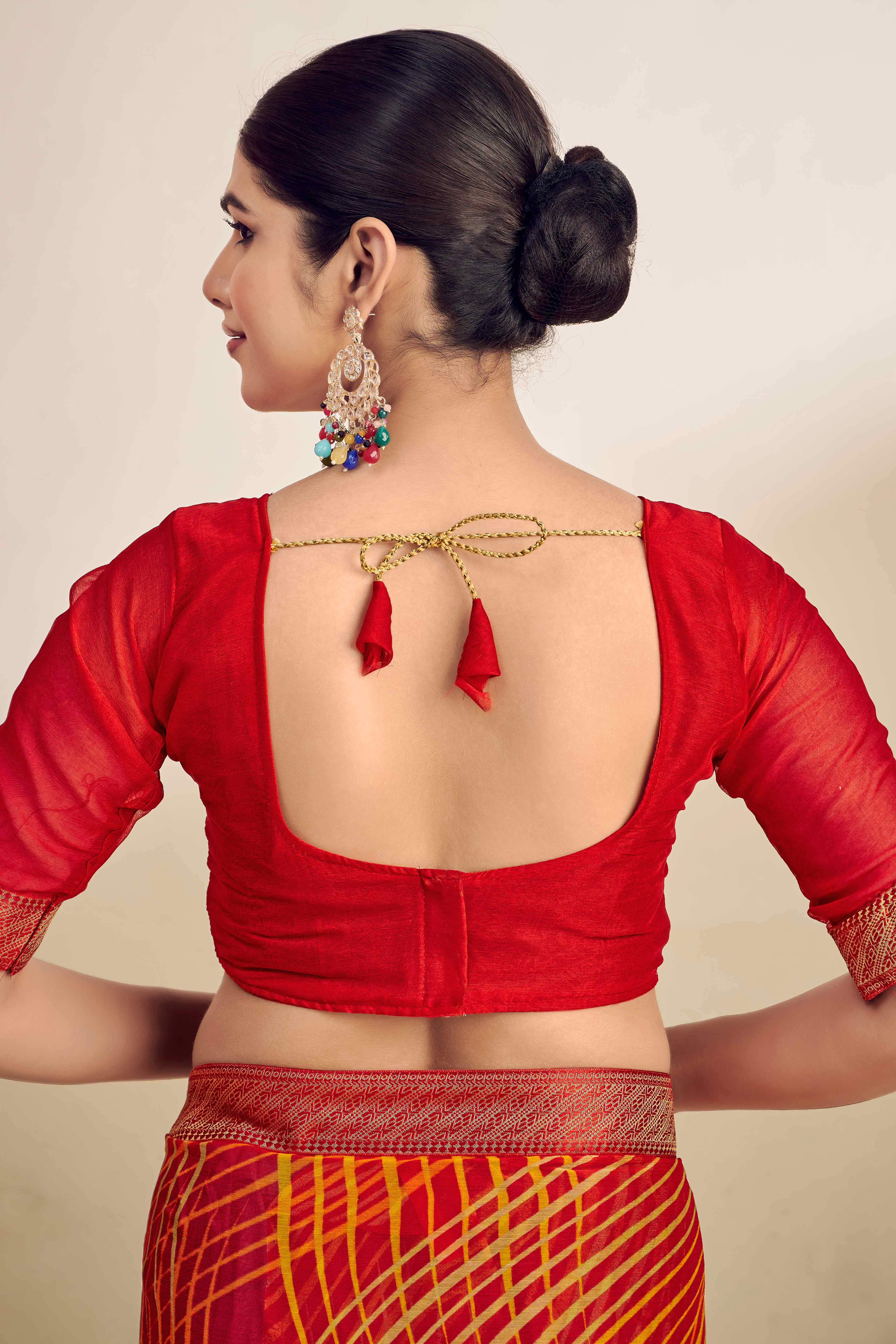 Orange Chiffon Saree Adorned With Artistic Print & Finely Crafted Woven Lace Border