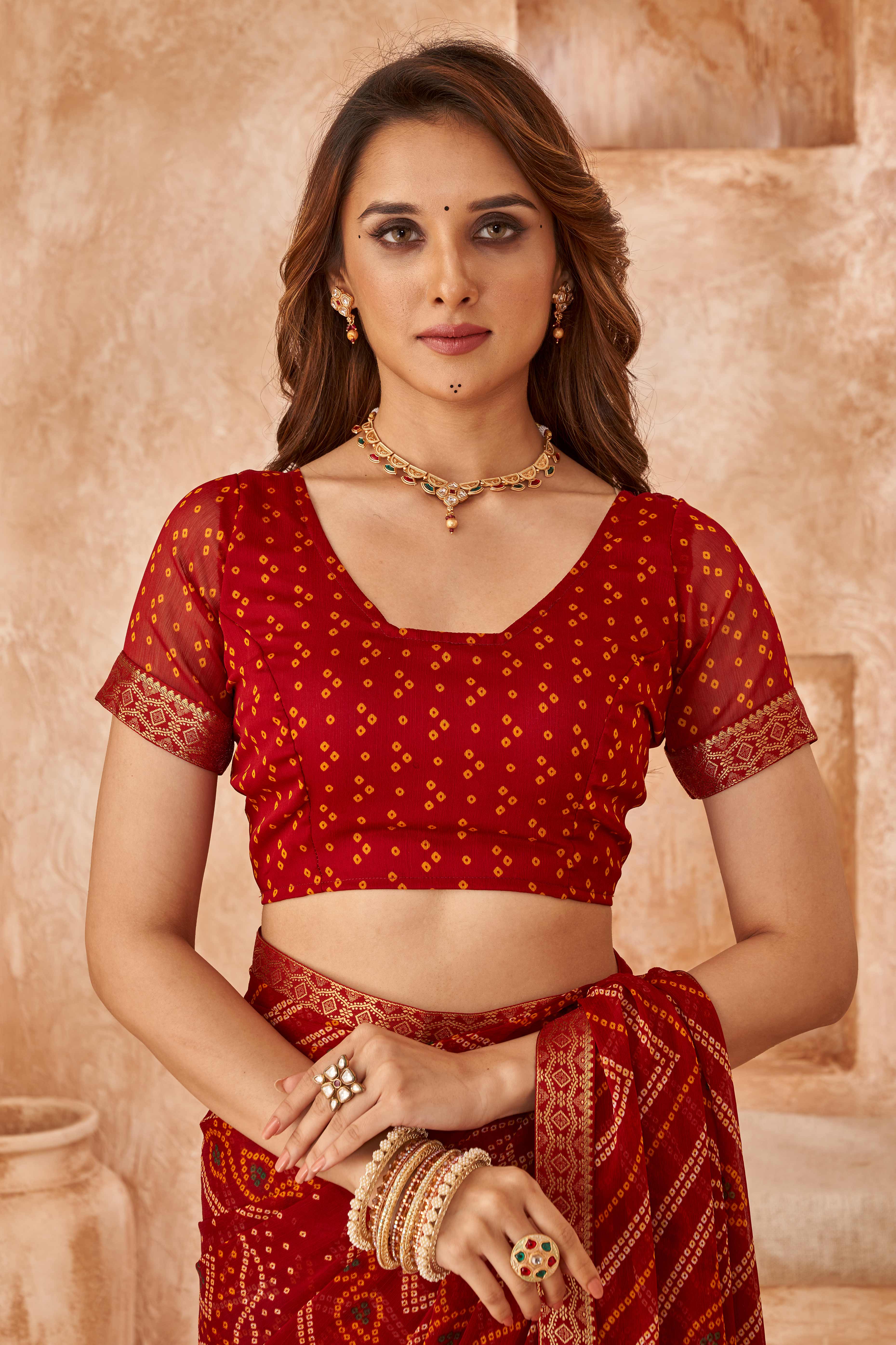 Maroon Chiffon Saree Featuring Traditional Bandhani Prints & A Graceful Lace Edge