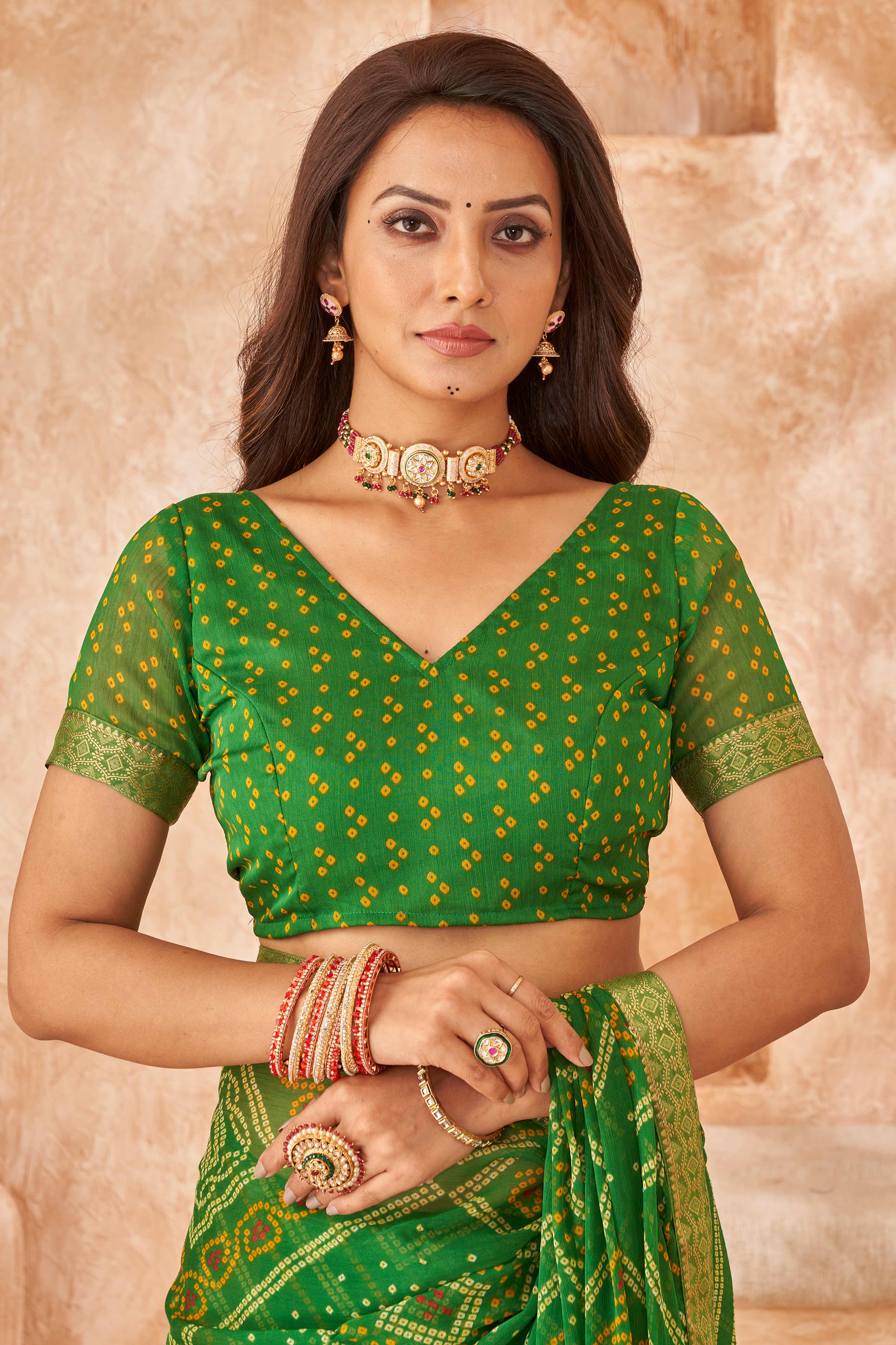 Green Chiffon Saree Featuring Traditional Bandhani Prints & A Graceful Lace Edge