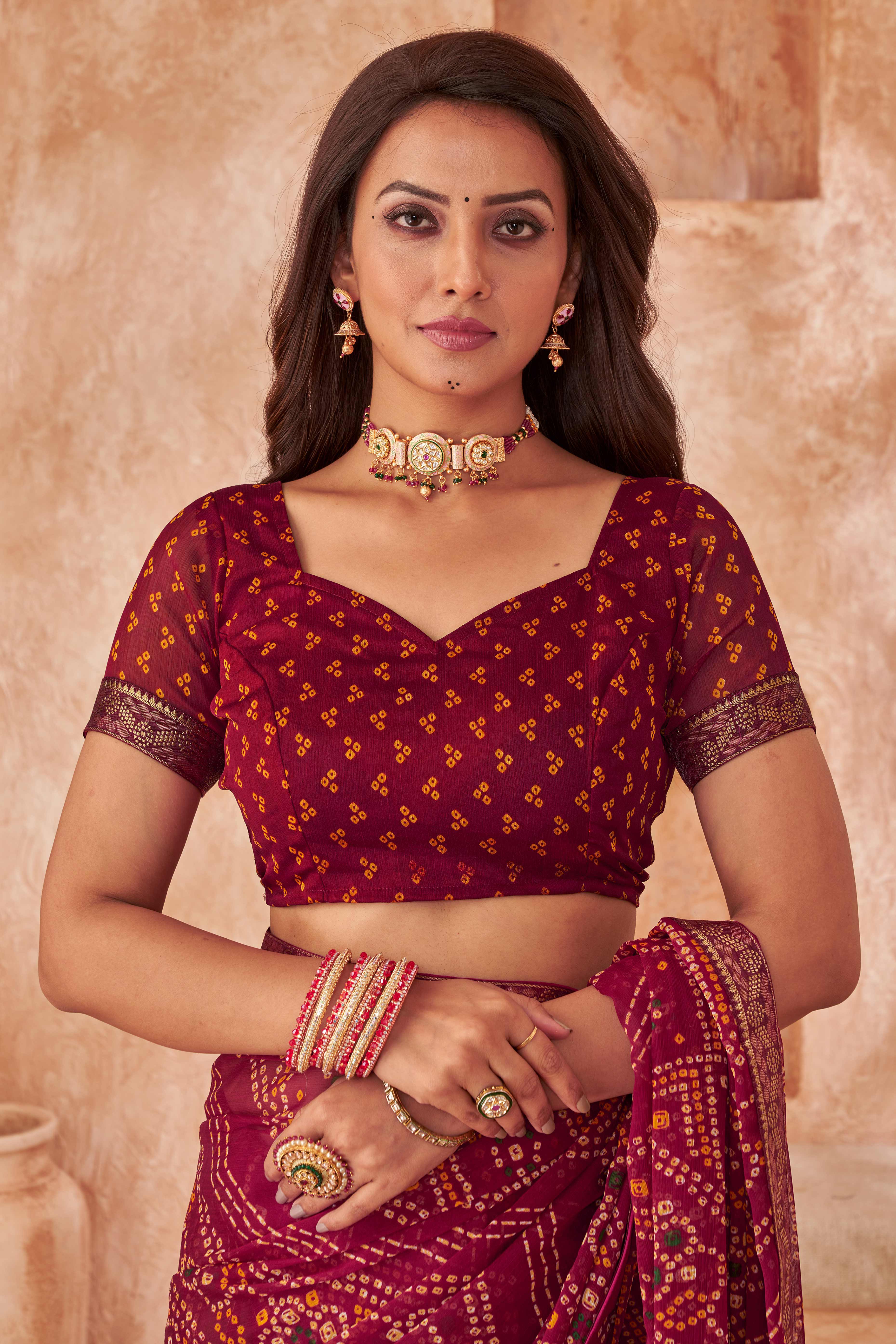 Maroon Chiffon Saree Featuring Traditional Bandhani Prints & A Graceful Lace Edge