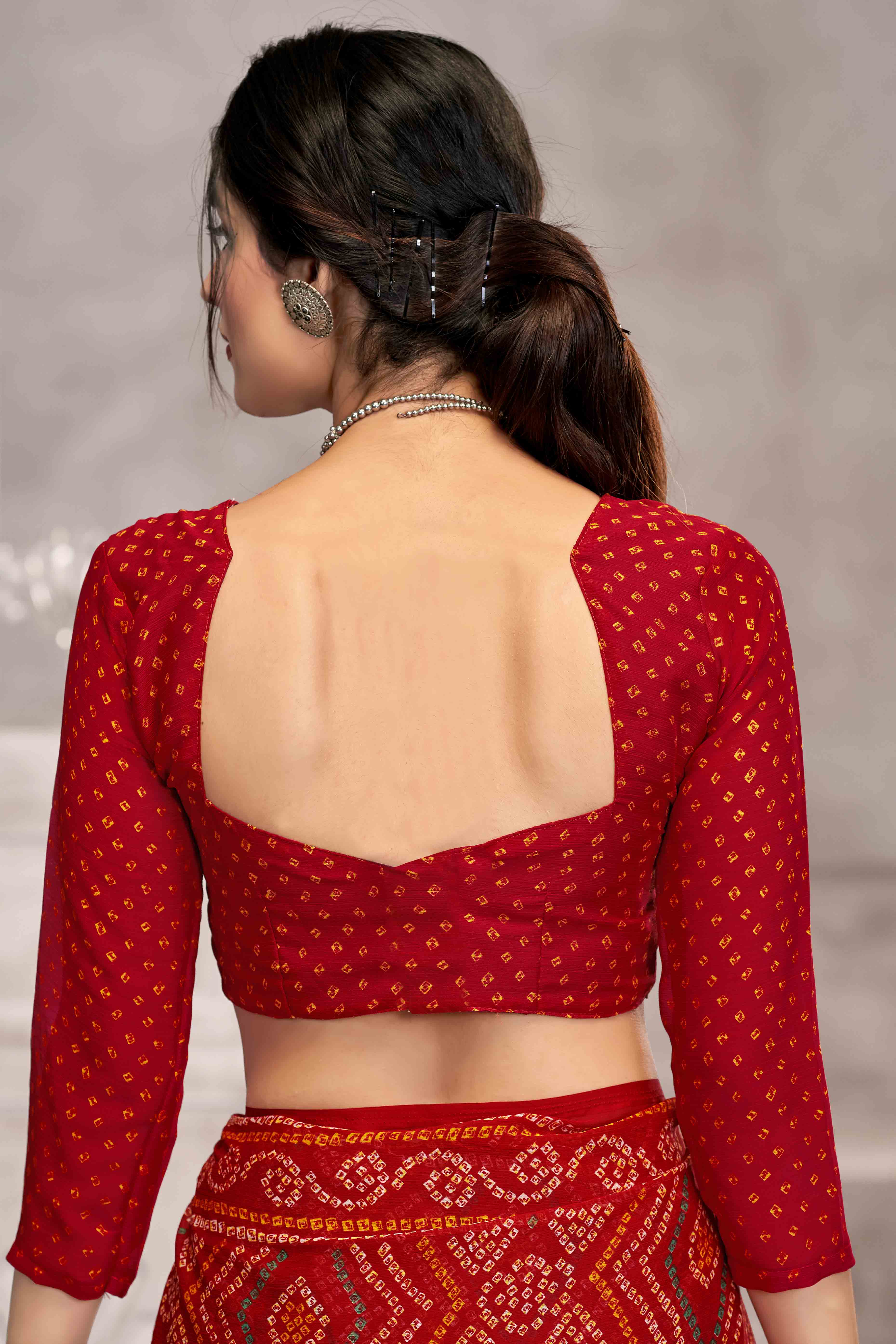 Red Chiffon Saree Features Bandhani Print for Casual Occasion