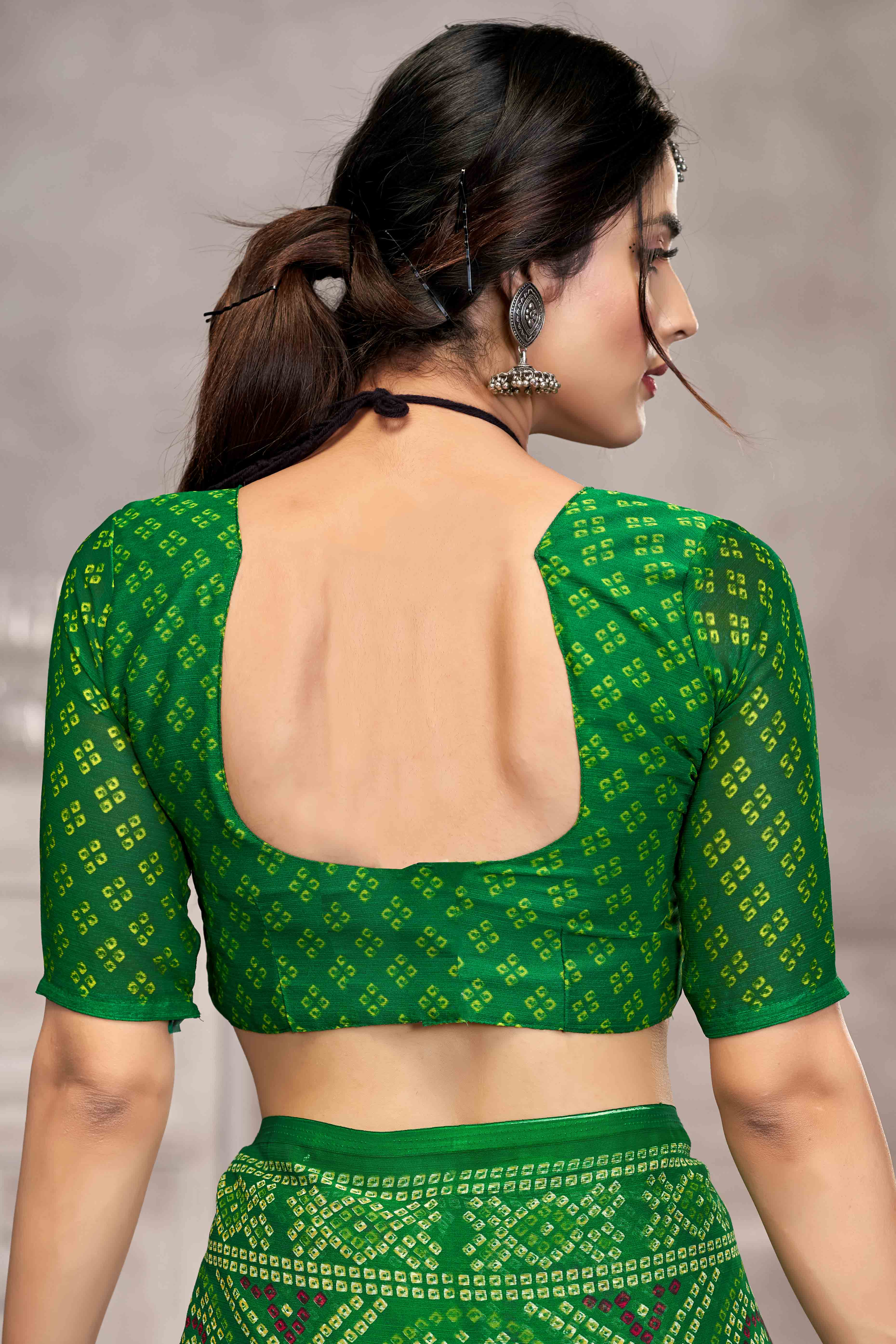 Green Chiffon Saree Features Bandhani Print for Casual Occasion