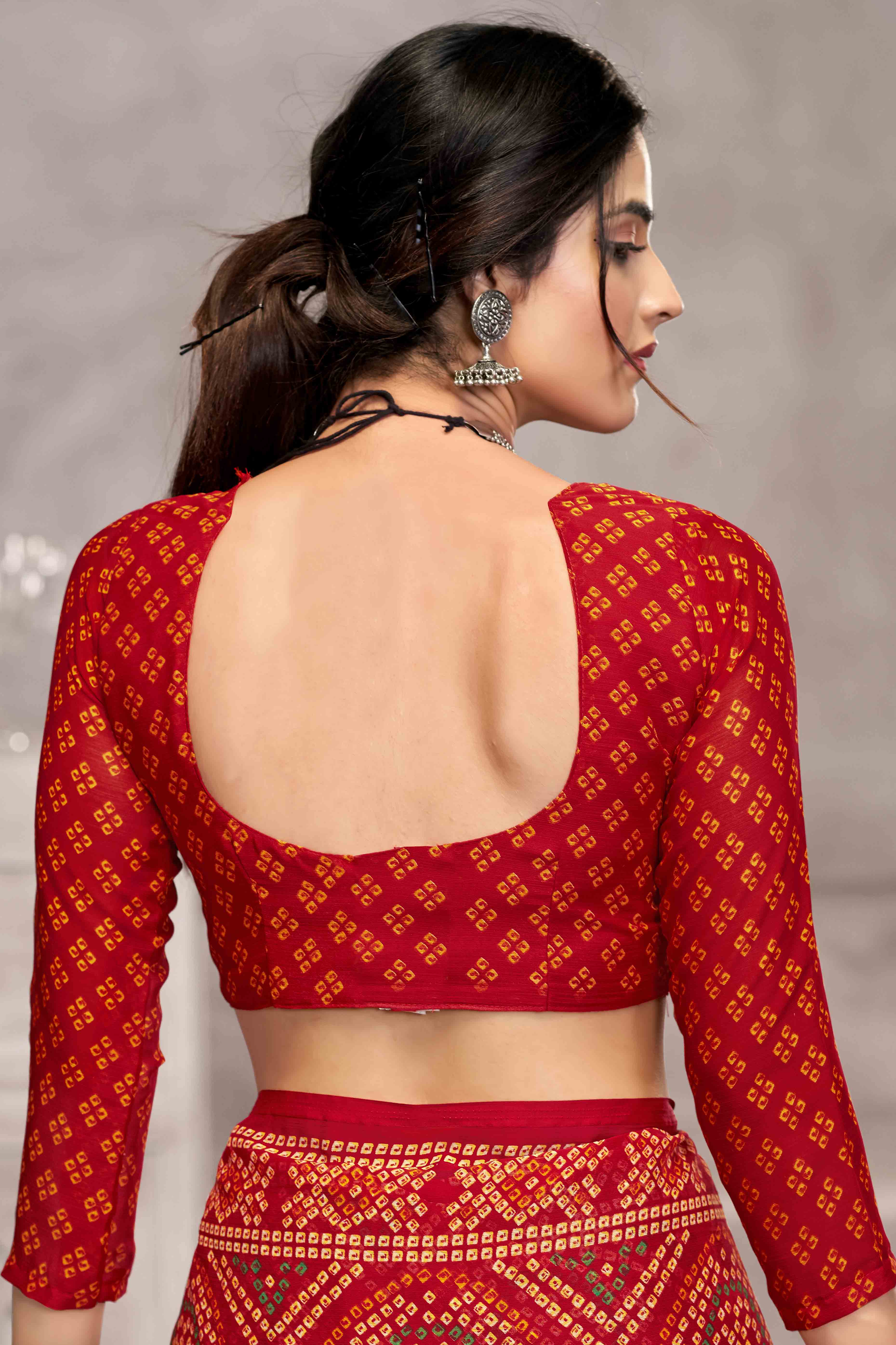 Red Chiffon Saree Features Bandhani Print for Casual Occasion