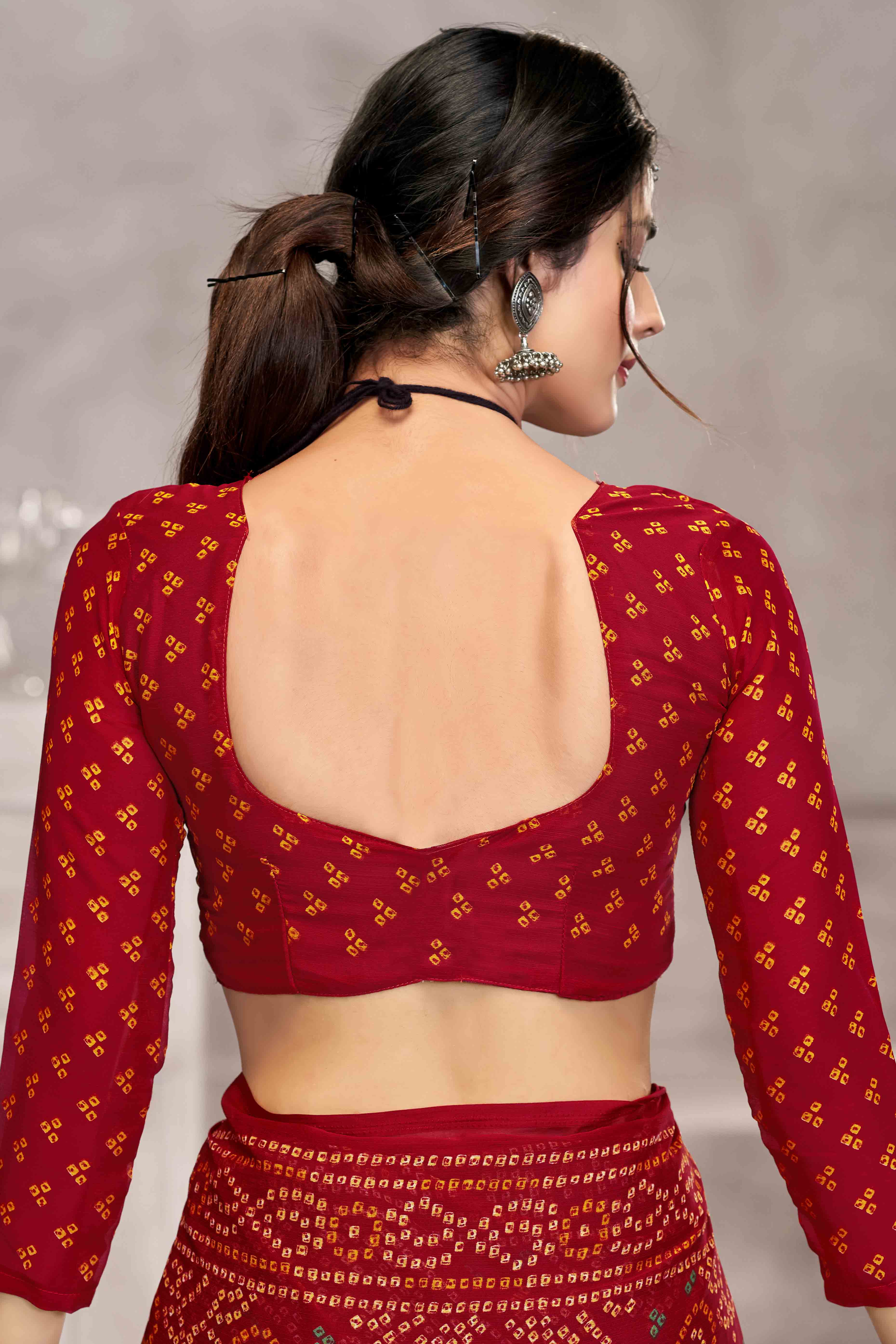Red Chiffon Saree Features Bandhani Print for Casual Occasion