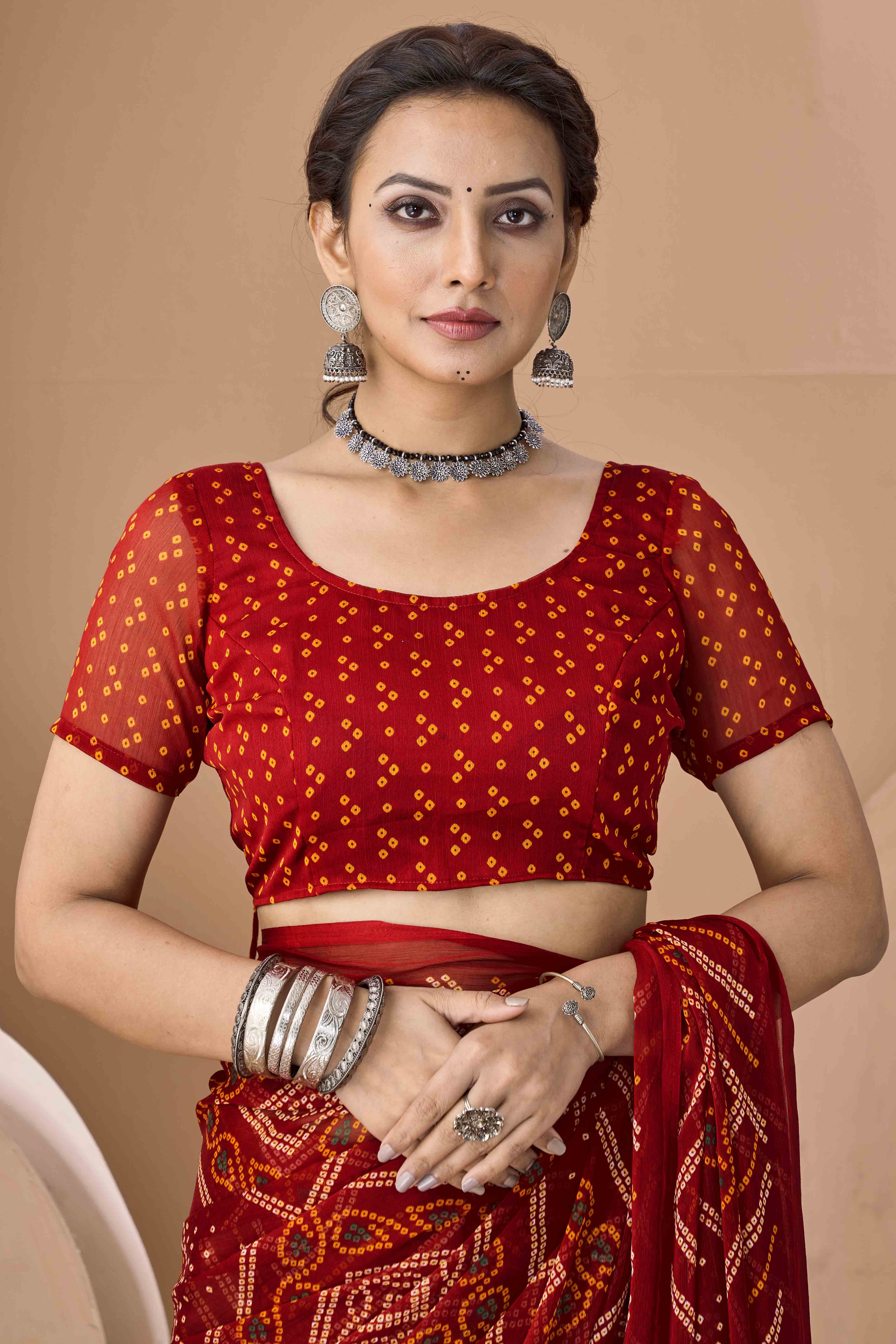 Maroon Bandhani Printed Chiffon Saree Accented With Intricate Lace Border Work